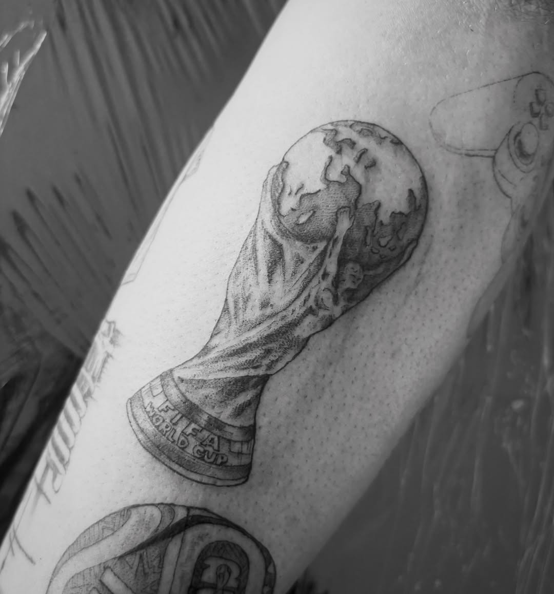 Fifa world cup trophy dotwork tattoo on the forearm by @secretlinetattoo