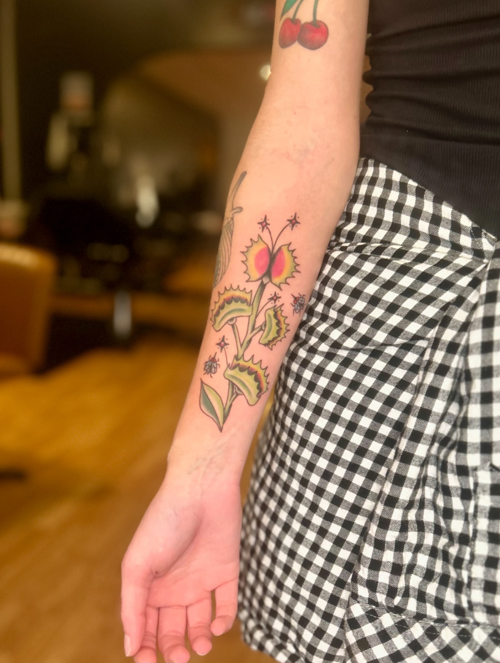 Floral arrangement American traditional tattoo on the forearm by Tori Magill