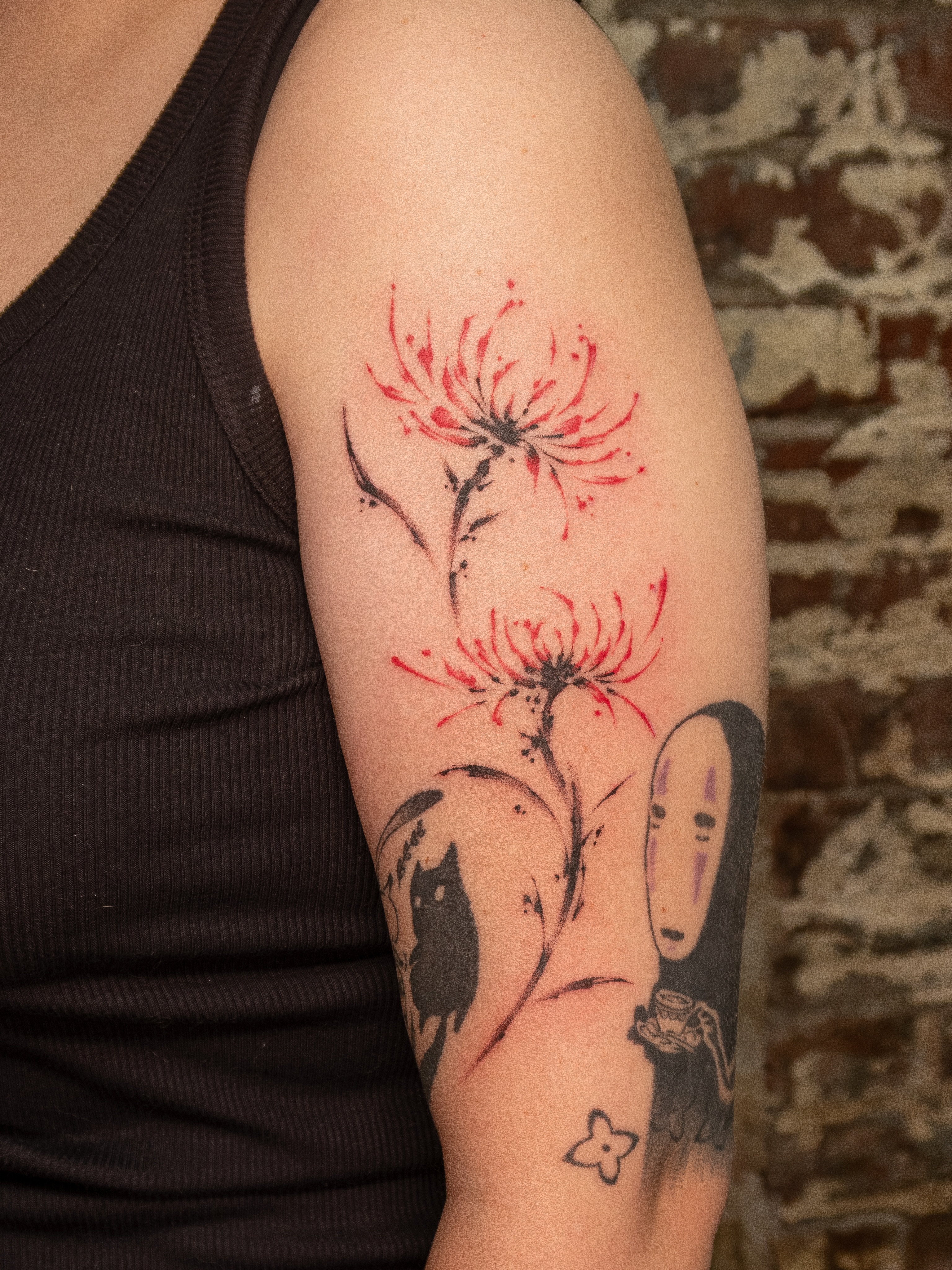 Chrysanthemums and No-Face dotwork tattoo on the forearm by justin