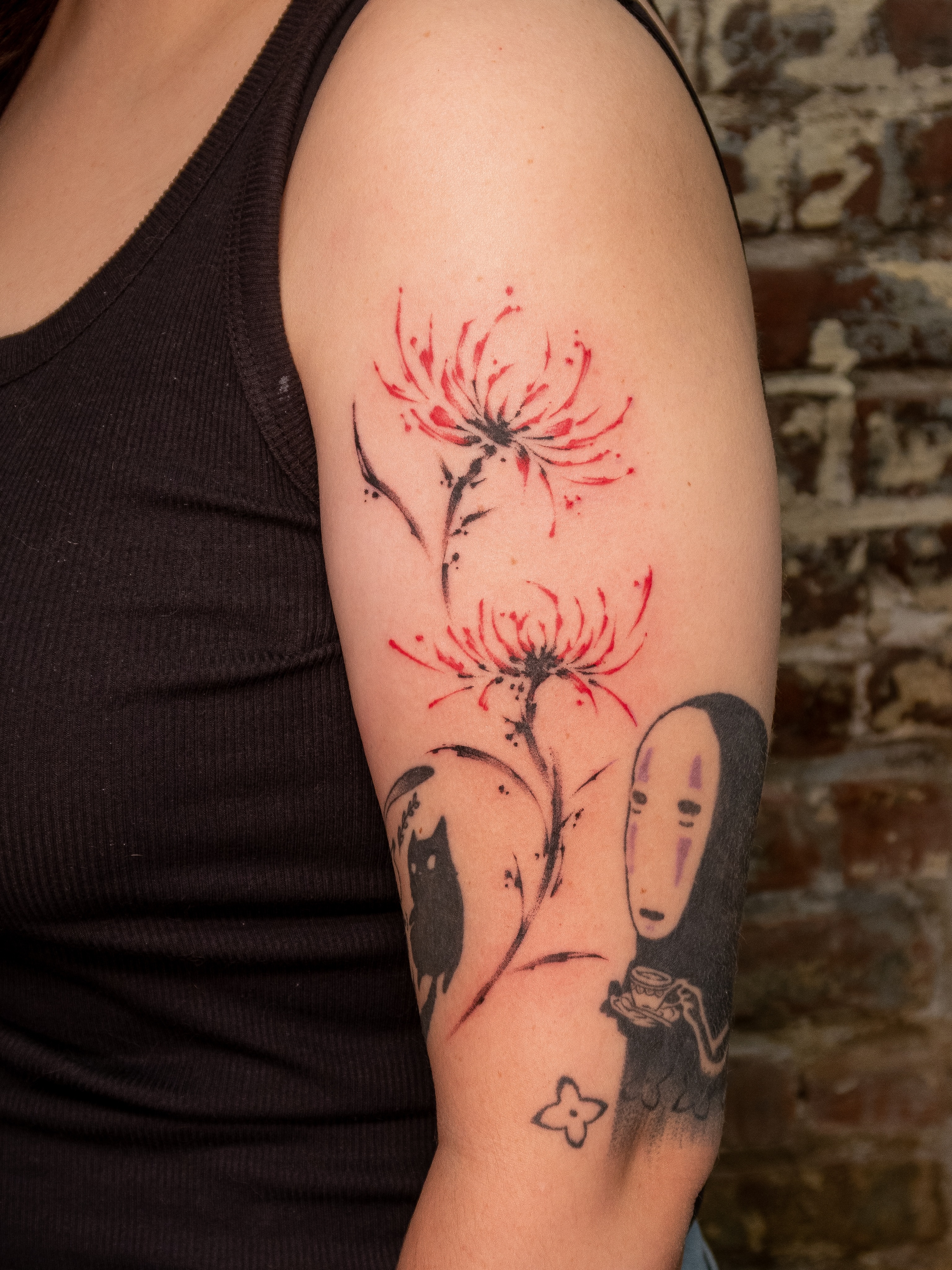 Chrysanthemum and No-Face dotwork tattoo on the forearm by justin