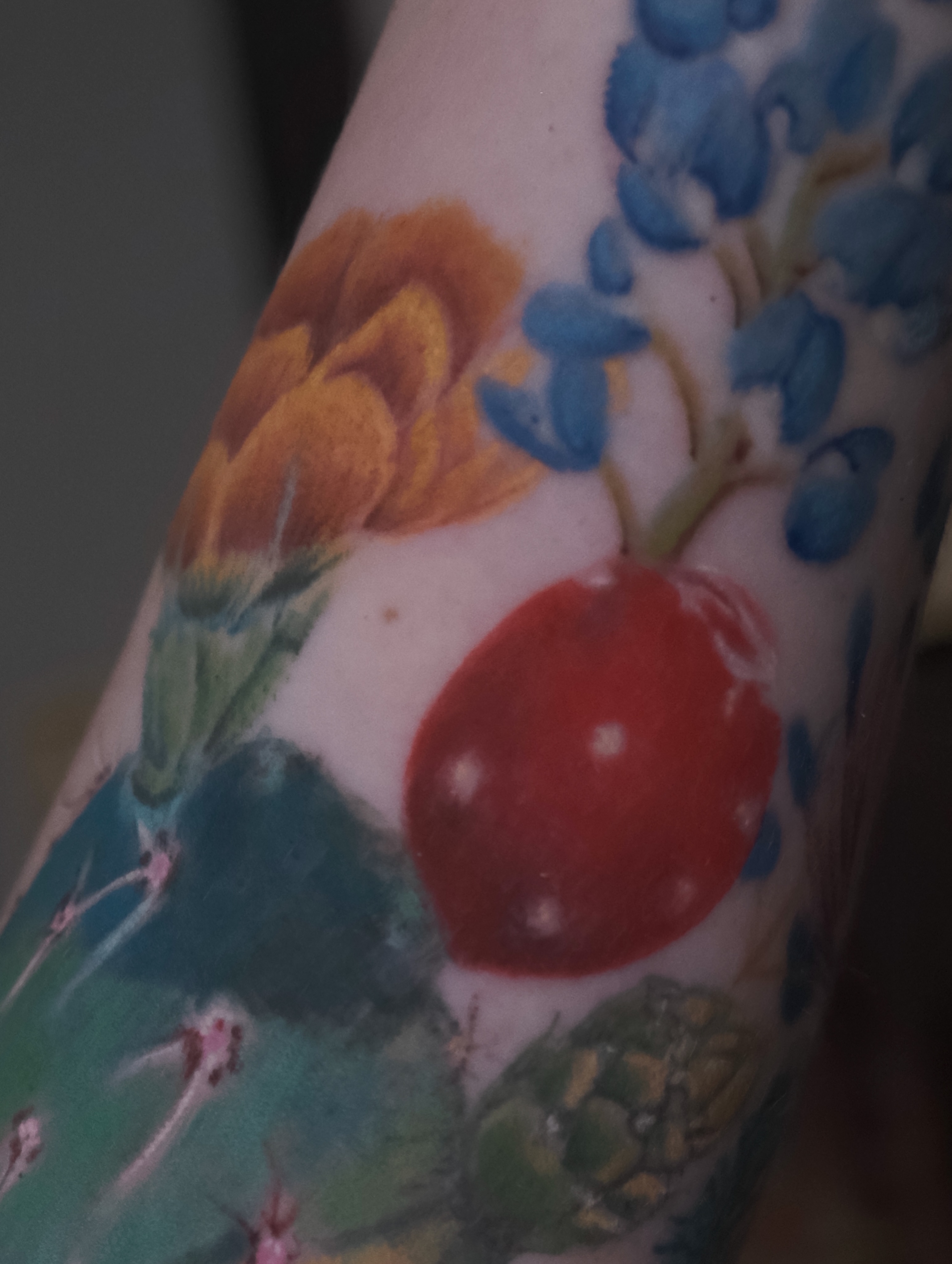 Fruit and floral watercolor tattoo on the forearm by AL 777, Denton, Texas
