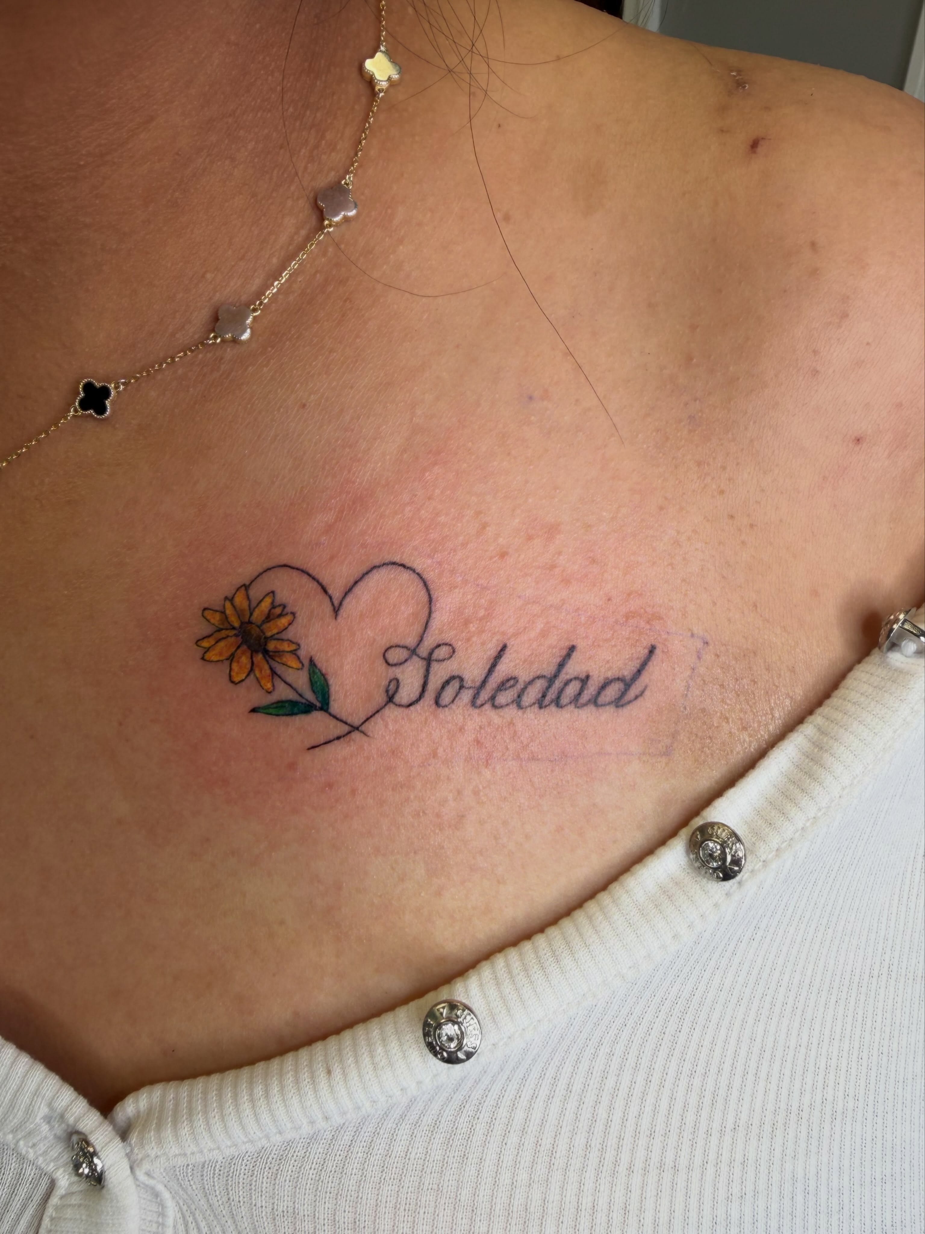 Sunflower and heart fine line tattoo on the chest by linda perez