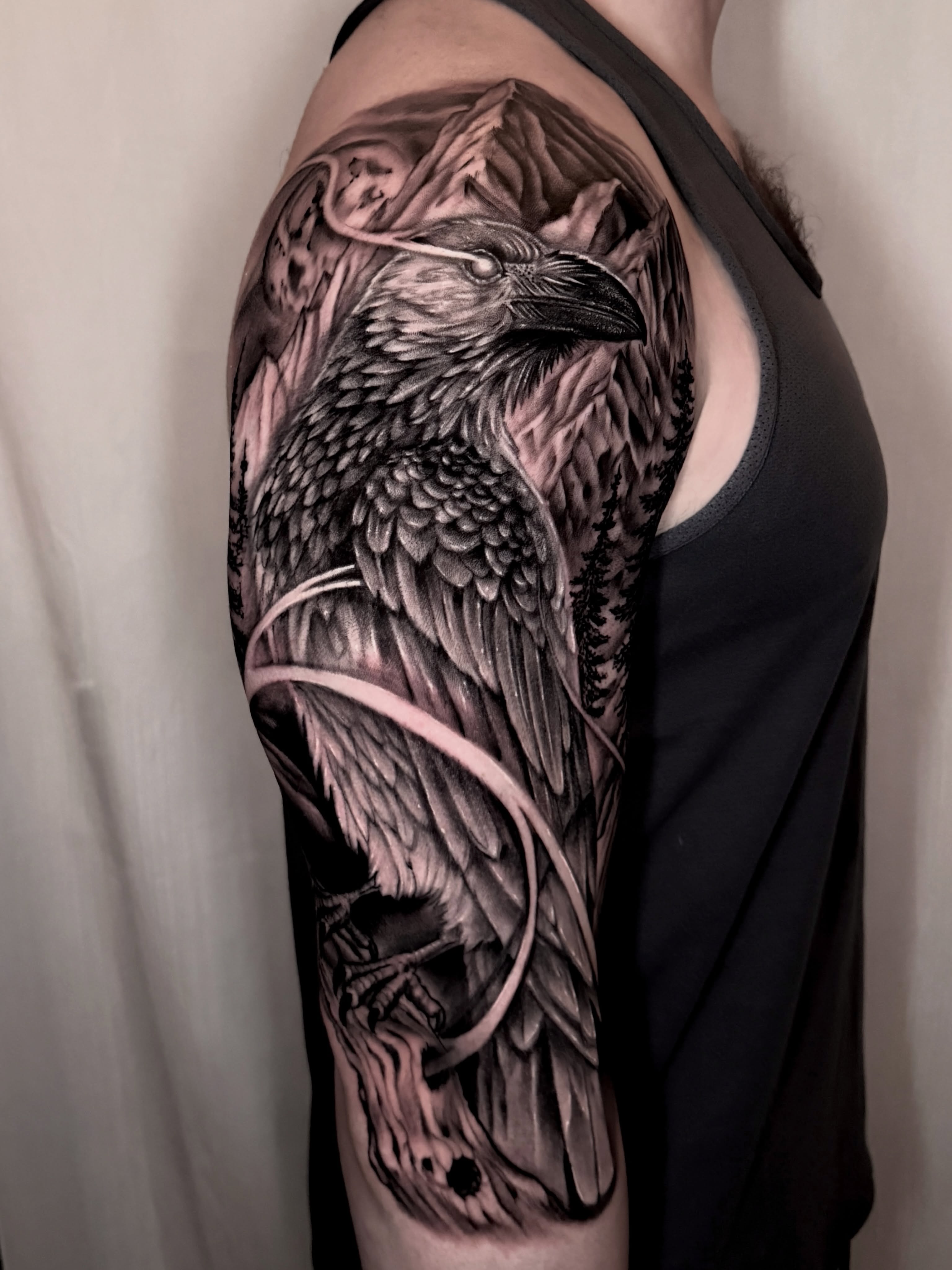 Crow realism tattoo on the upper arm by Ty Pallotta, Austin, Texas