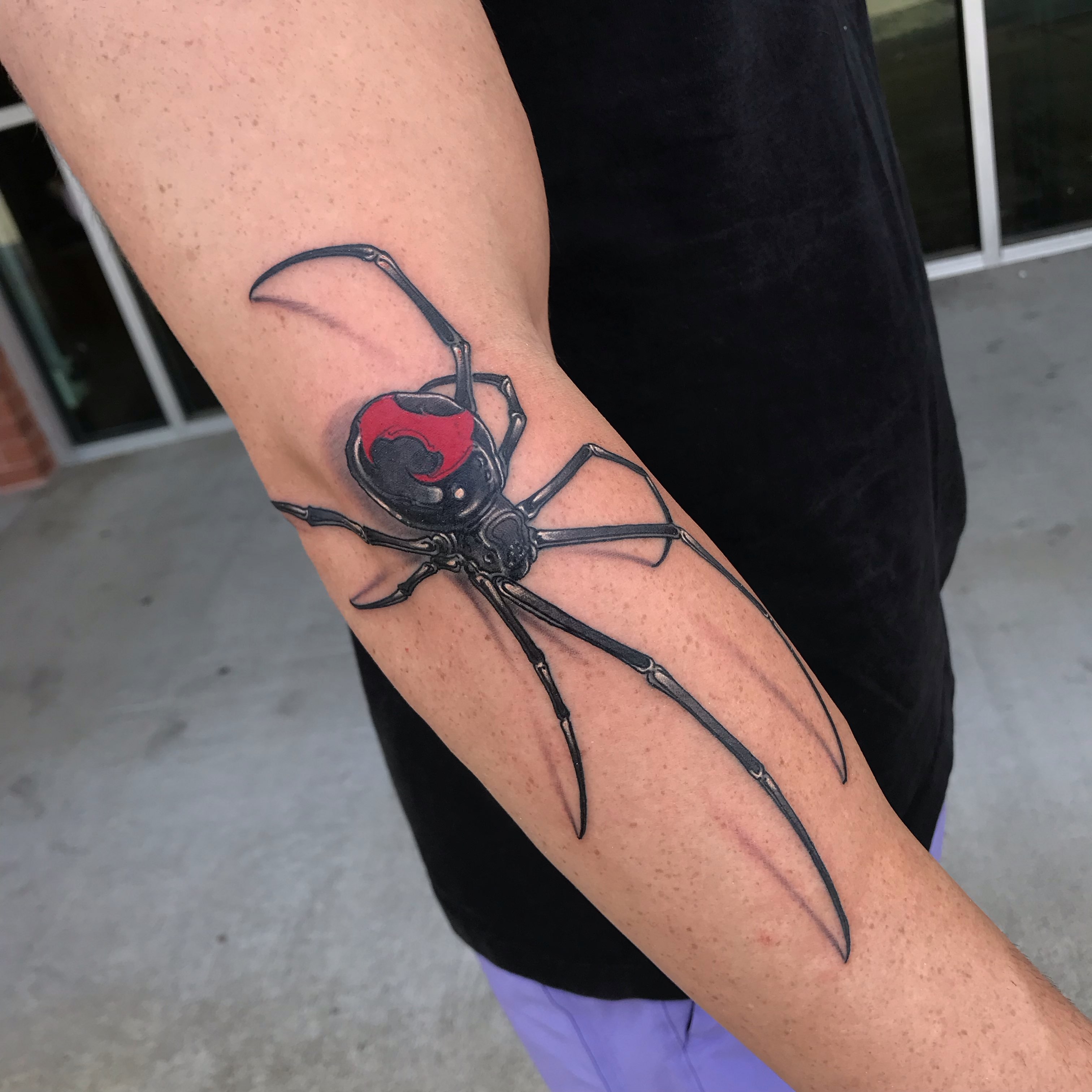 Spider realism tattoo on the forearm by Rick Rayne