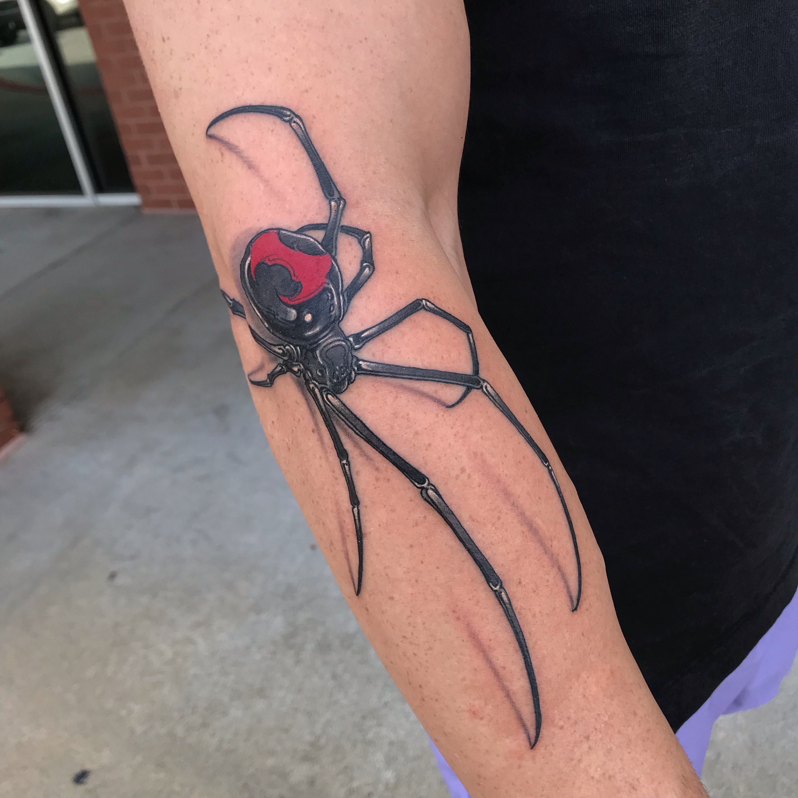 Spider realism tattoo on the forearm by Rick Rayne
