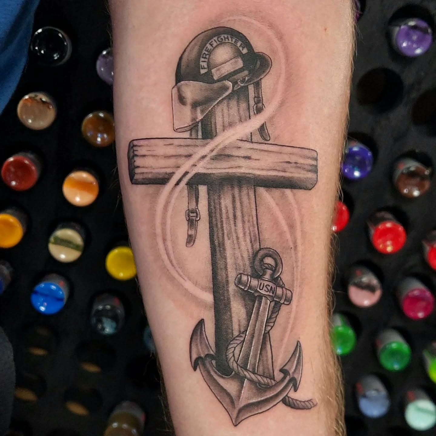 Cross and anchor realism tattoo on the forearm by Jason August