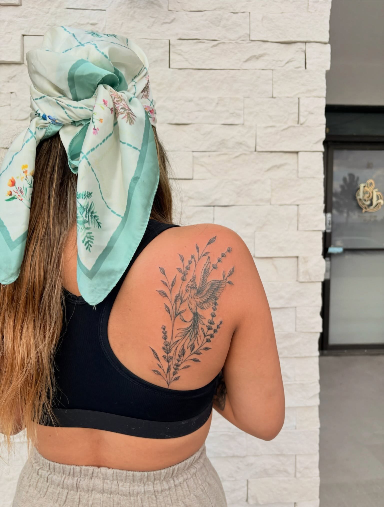 Bird and floral black and grey tattoo on the shoulder by tati 🇬🇺🇵🇭