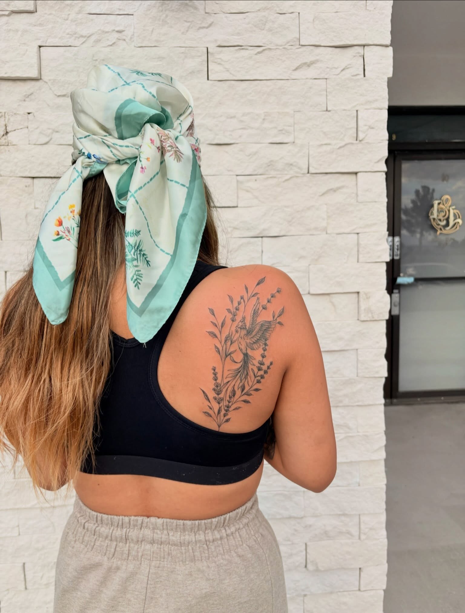 Bird and floral black and grey tattoo on the shoulder by tati 🇬🇺🇵🇭