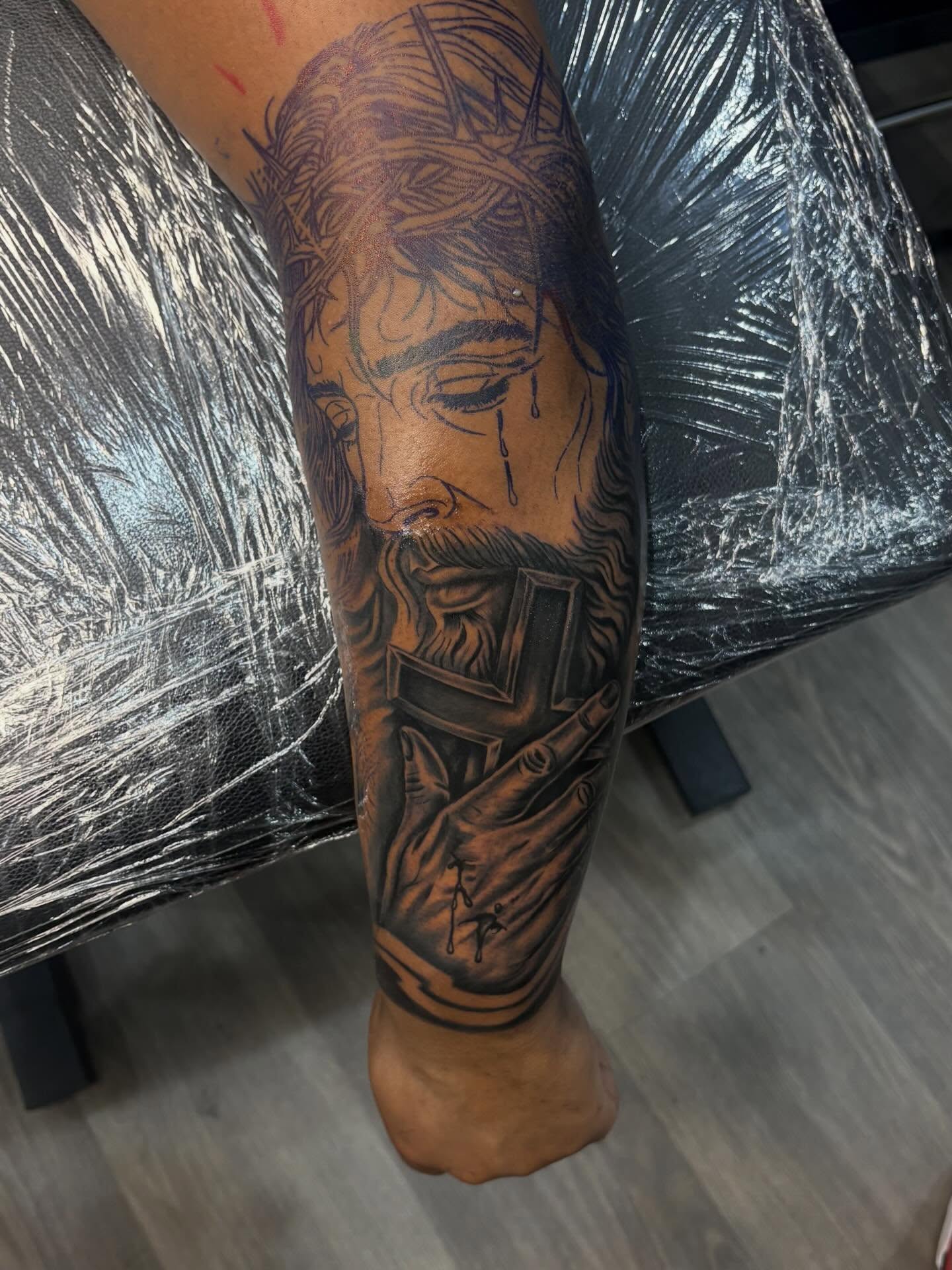 Religious figure realism tattoo on the forearm by 𓂀 𝕊ℍ𝔼𝕃𝕃𝕐 𓂀