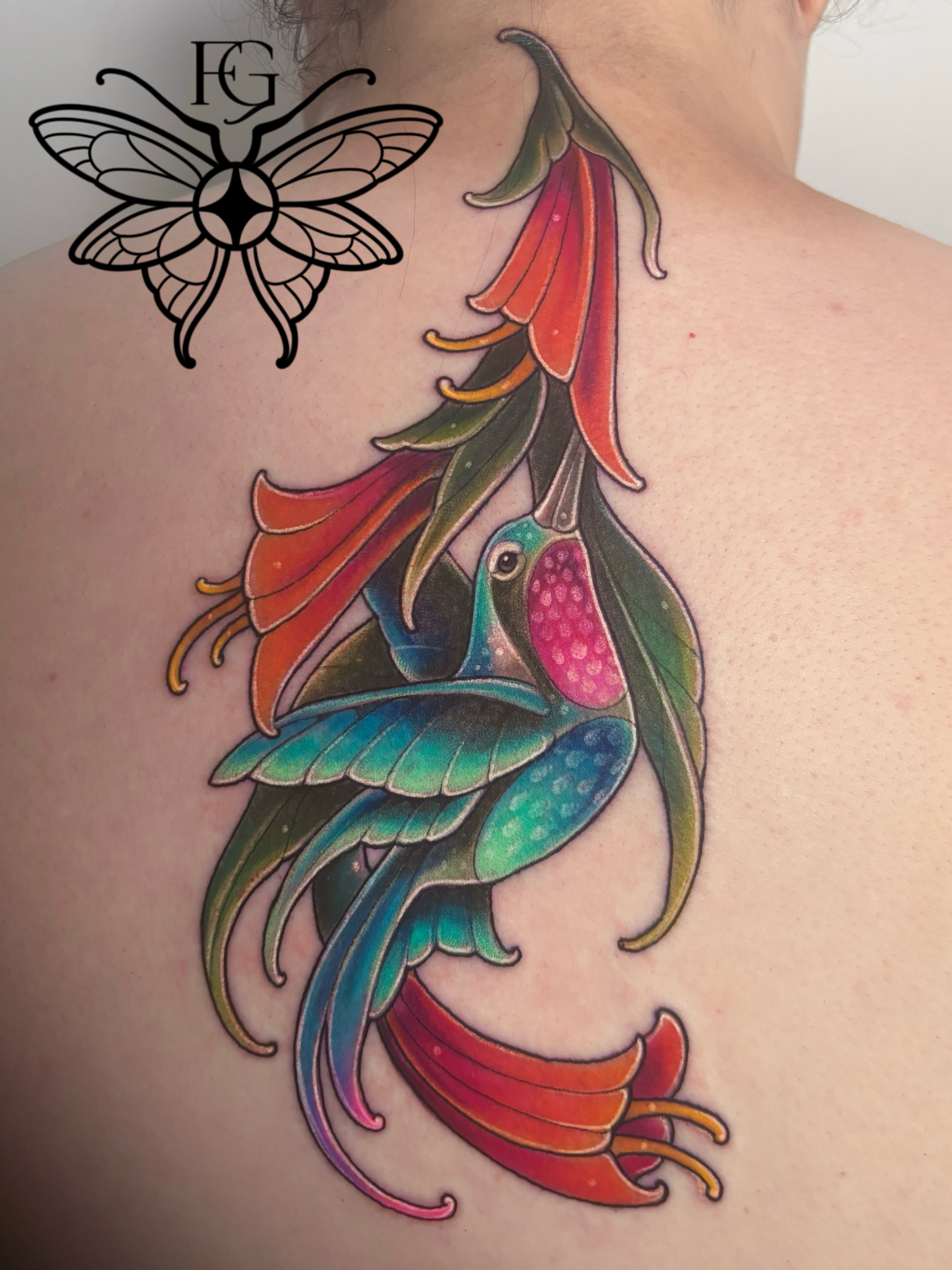 Hummingbird and flower new school tattoo on the back by Fairy Gremlin