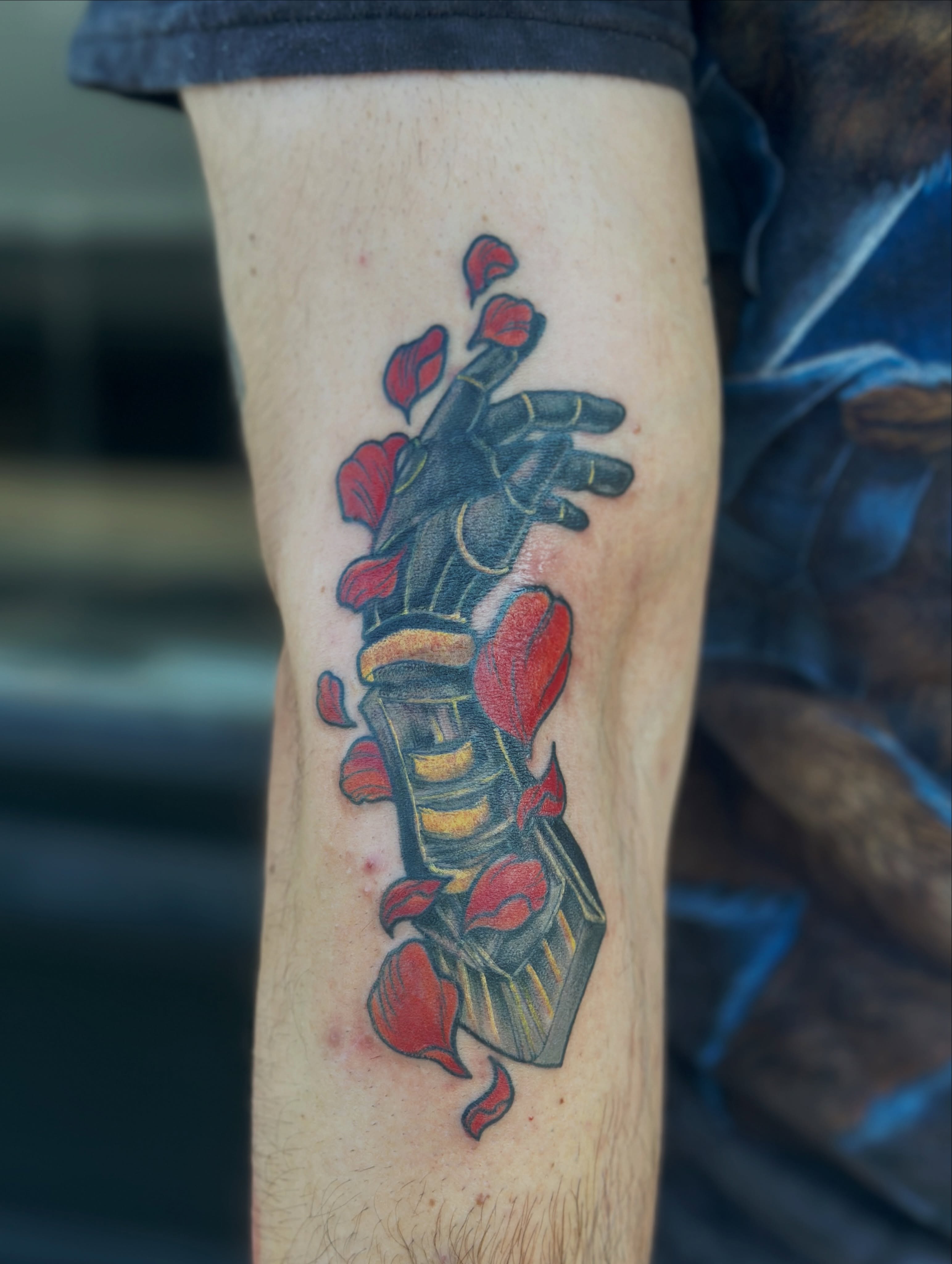 Mech hand with petals American traditional tattoo on the forearm by Gabrielle Brodman 🎀 Raleigh-Durham Tattoo