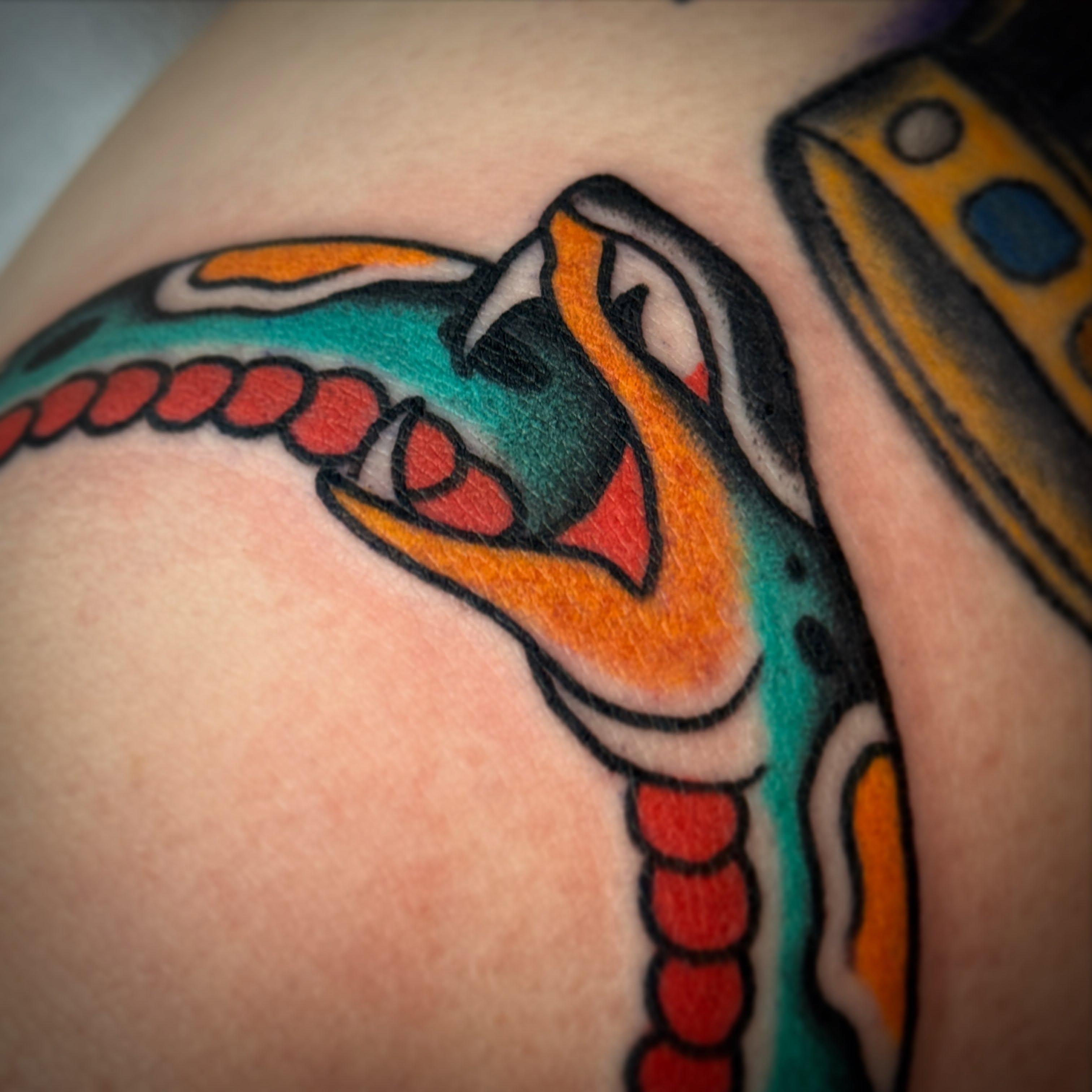 Snake American traditional tattoo on the upper arm by 🕸curtis Fink🕸