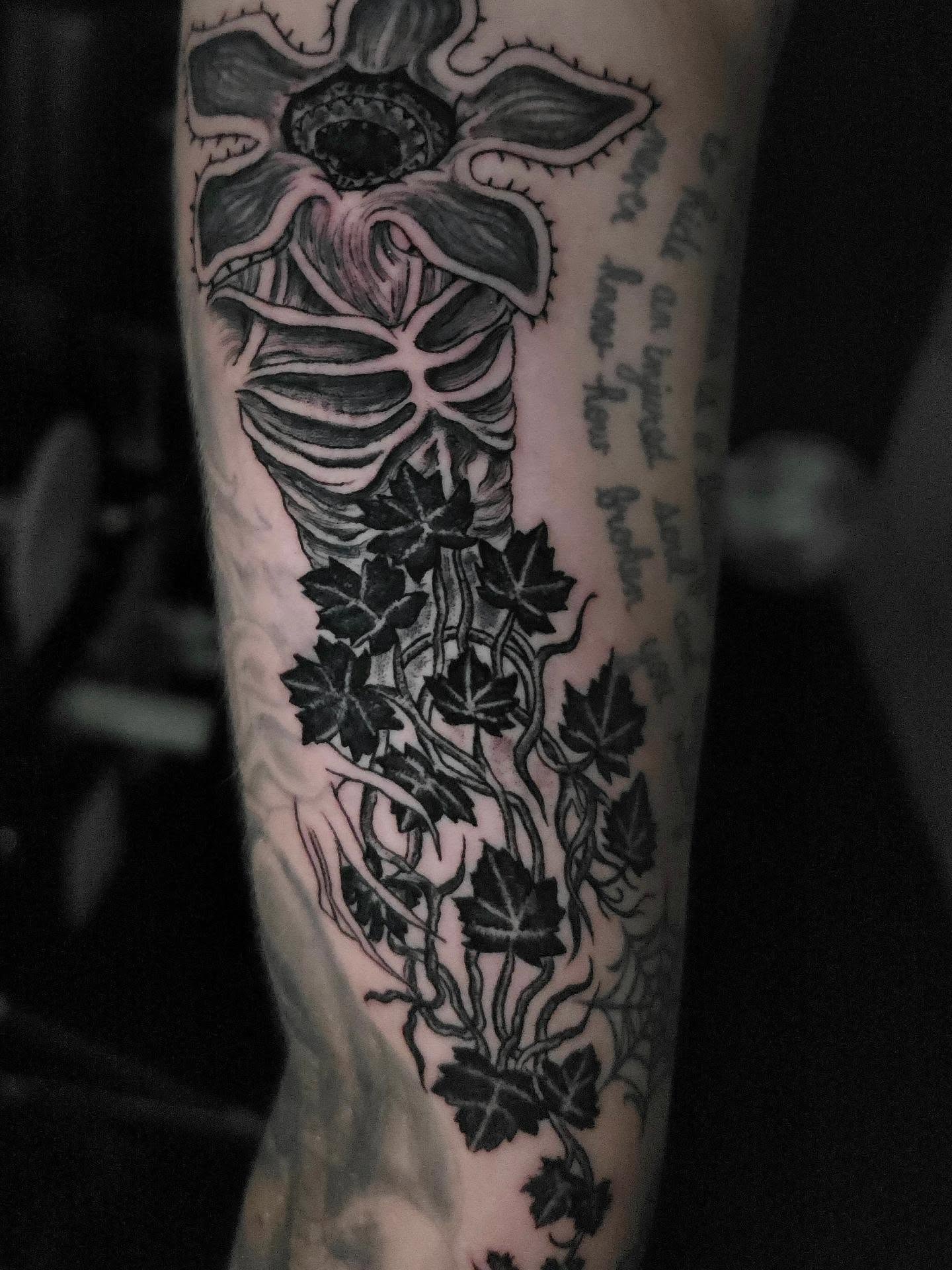 Cross and ivy realism tattoo on the forearm by xavia