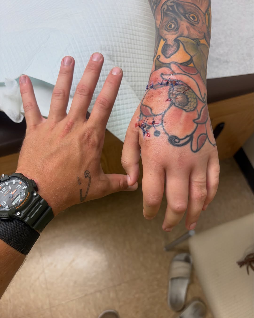 Flower and animal American traditional tattoo on the hand by Tattoos By Lola Cavotta, Willoughby, Ohio
