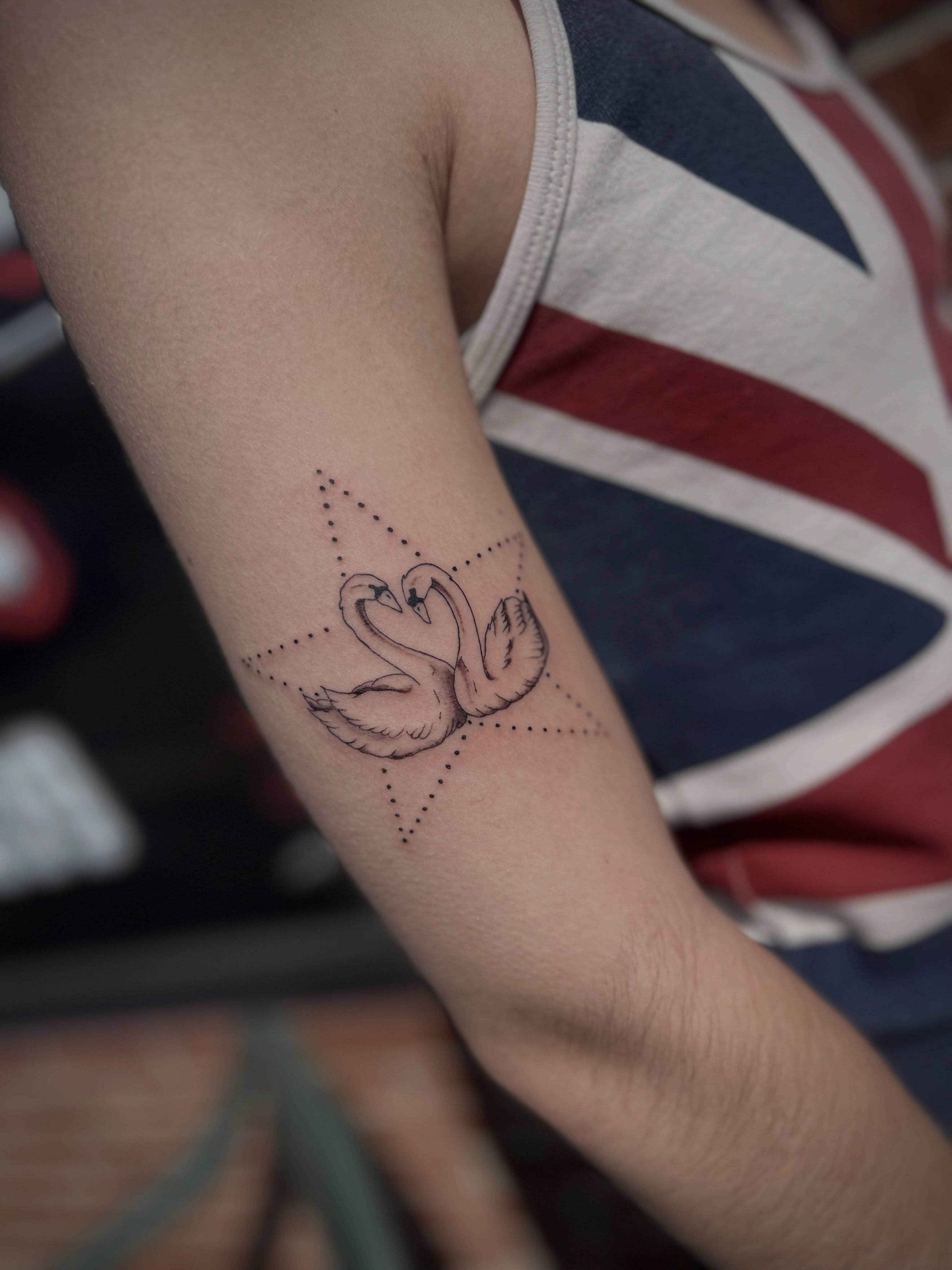 Swans dotwork tattoo on the forearm by Lexi Rose