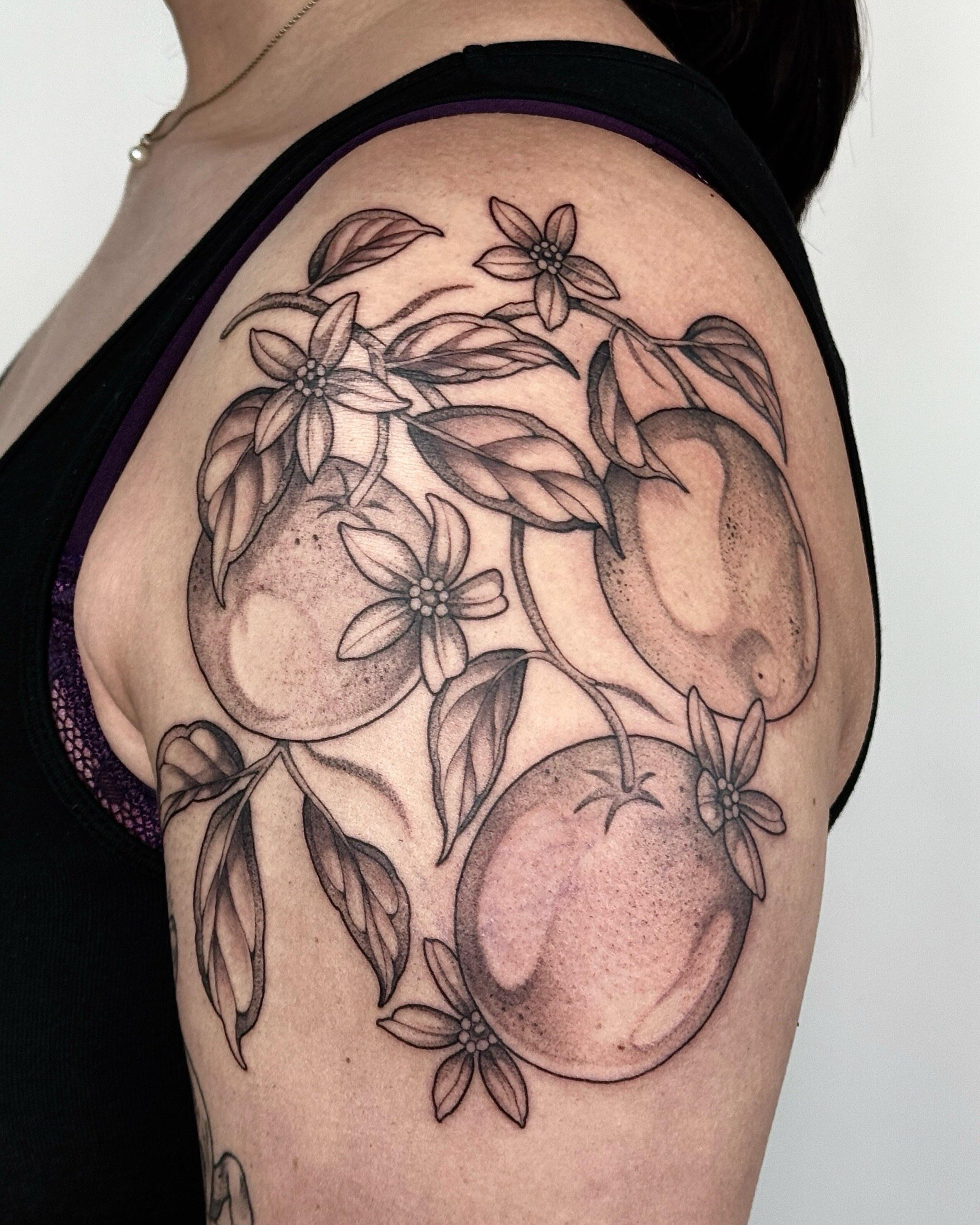 Fruit and flowers realism tattoo on the shoulder by 🌸delaney🌸