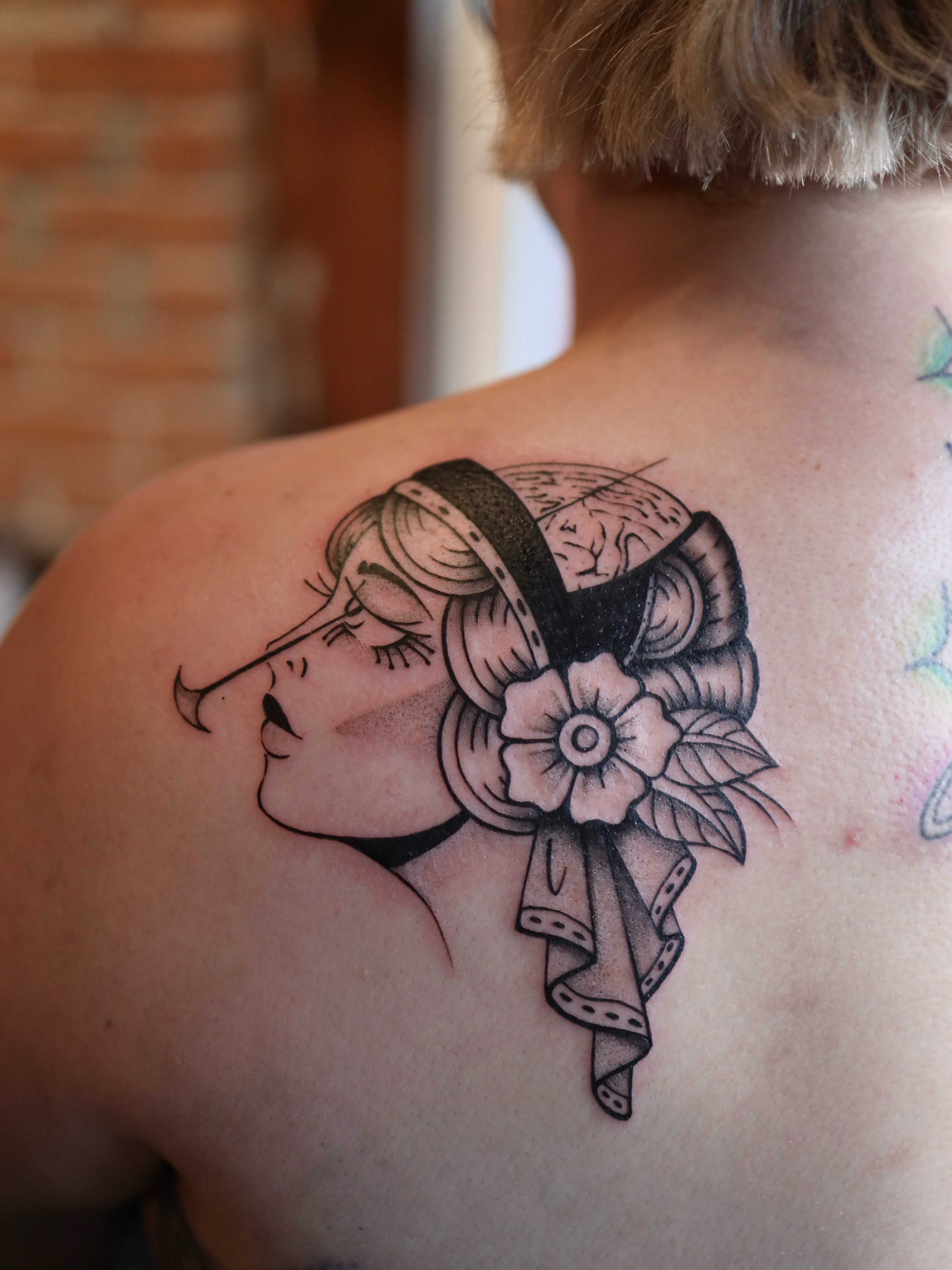 Flapper girl black and grey tattoo on the shoulder by morgan purcey