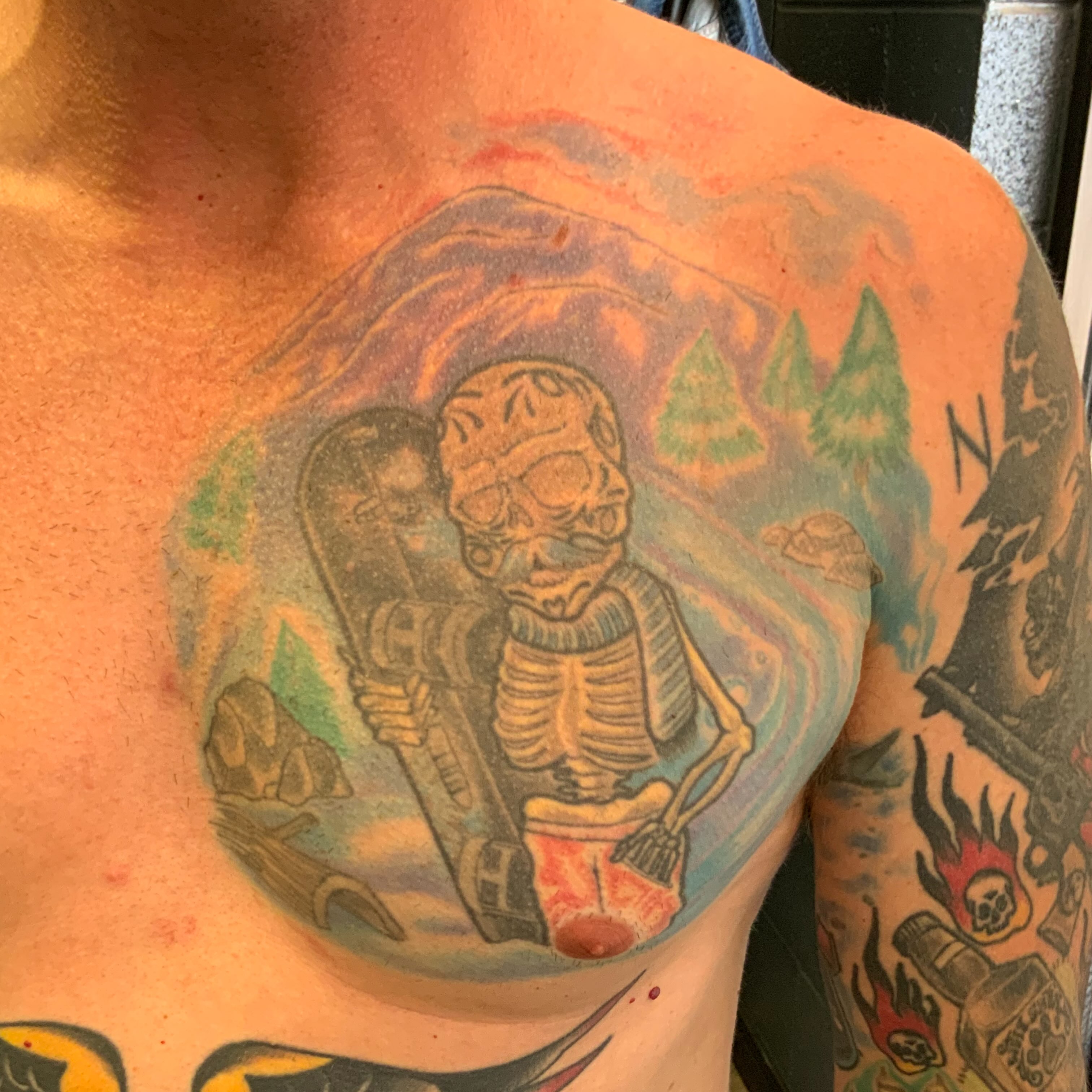 Skeleton with guitar American traditional tattoo on the chest by Kane L, Albuquerque, New Mexico