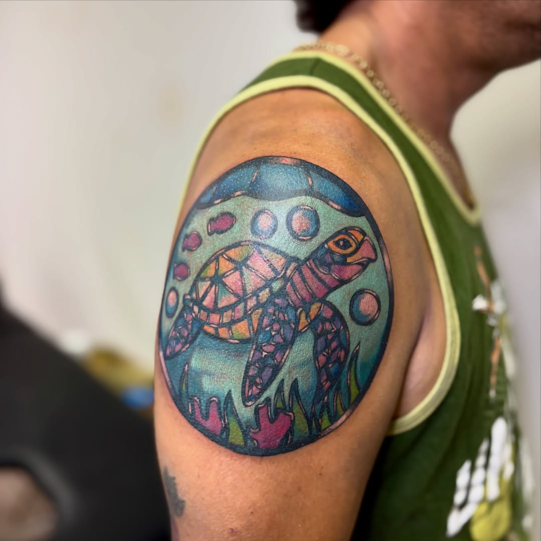 Sea turtle geometric tattoo on the shoulder by Taylor  Thompson