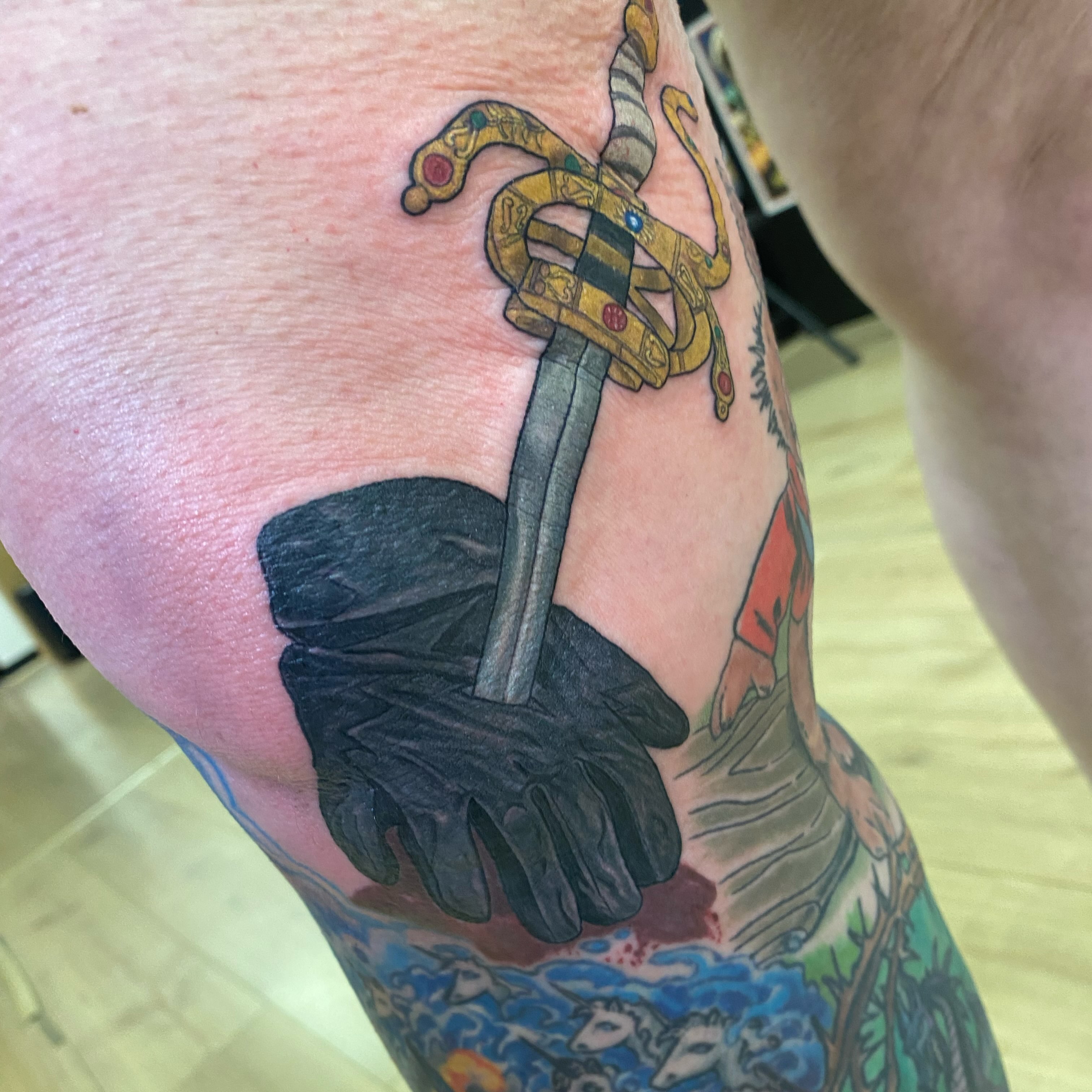 Sword and glove American traditional tattoo on the forearm by Katie Leeper