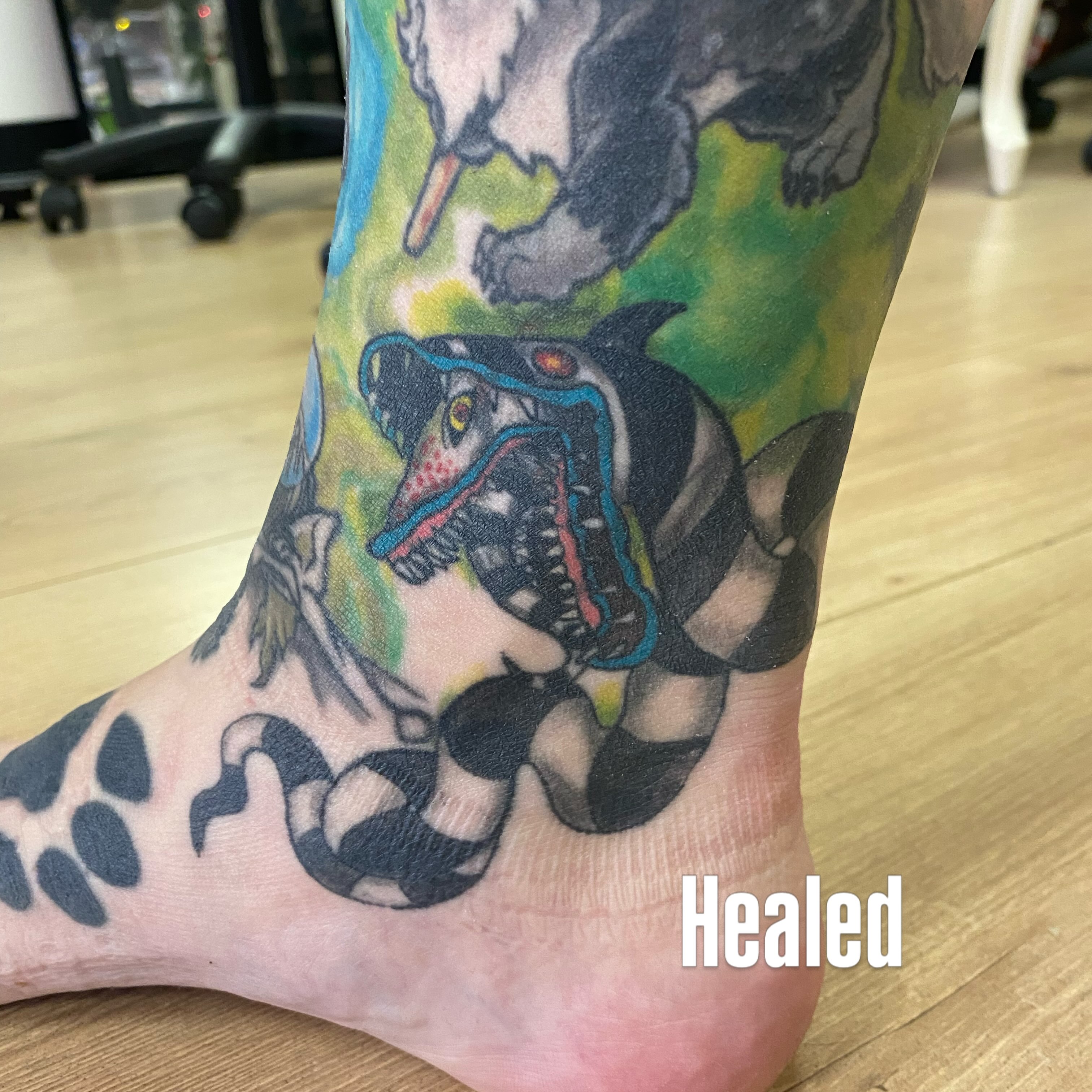 Dog wearing helmet new school tattoo on the foot by Katie Leeper