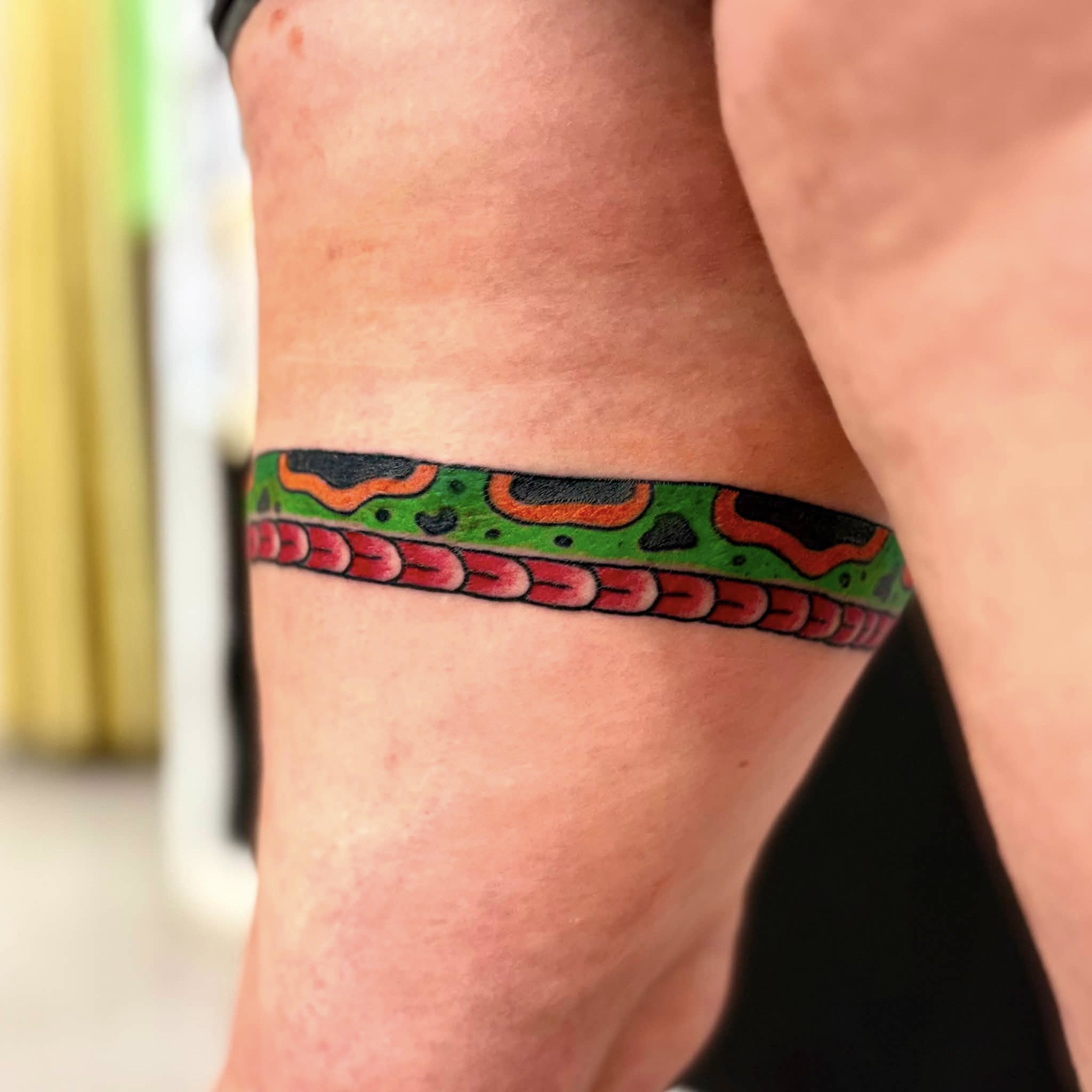 Snake new school tattoo on the forearm by Jon Anderson