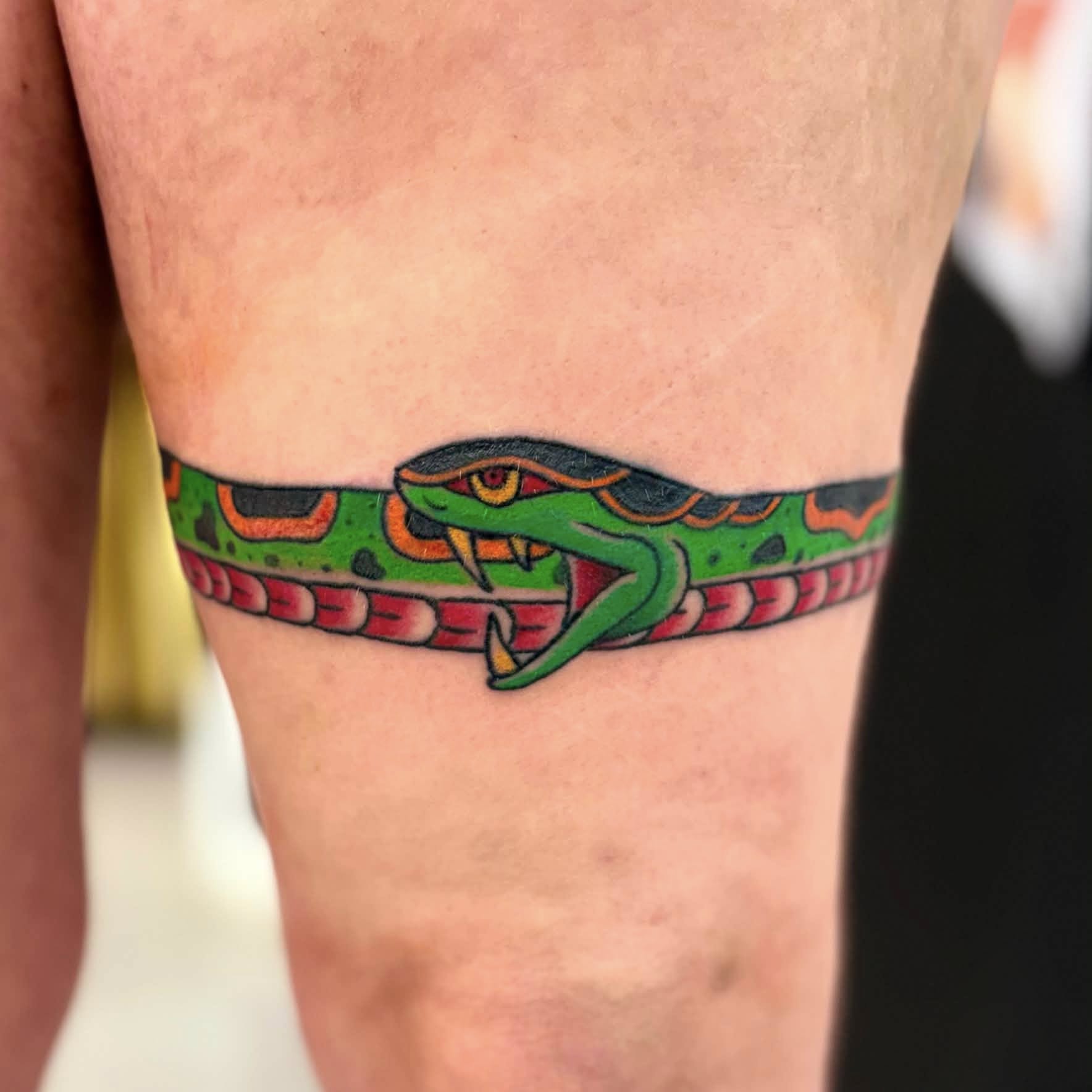 Snake realism tattoo on the forearm by Jon Anderson