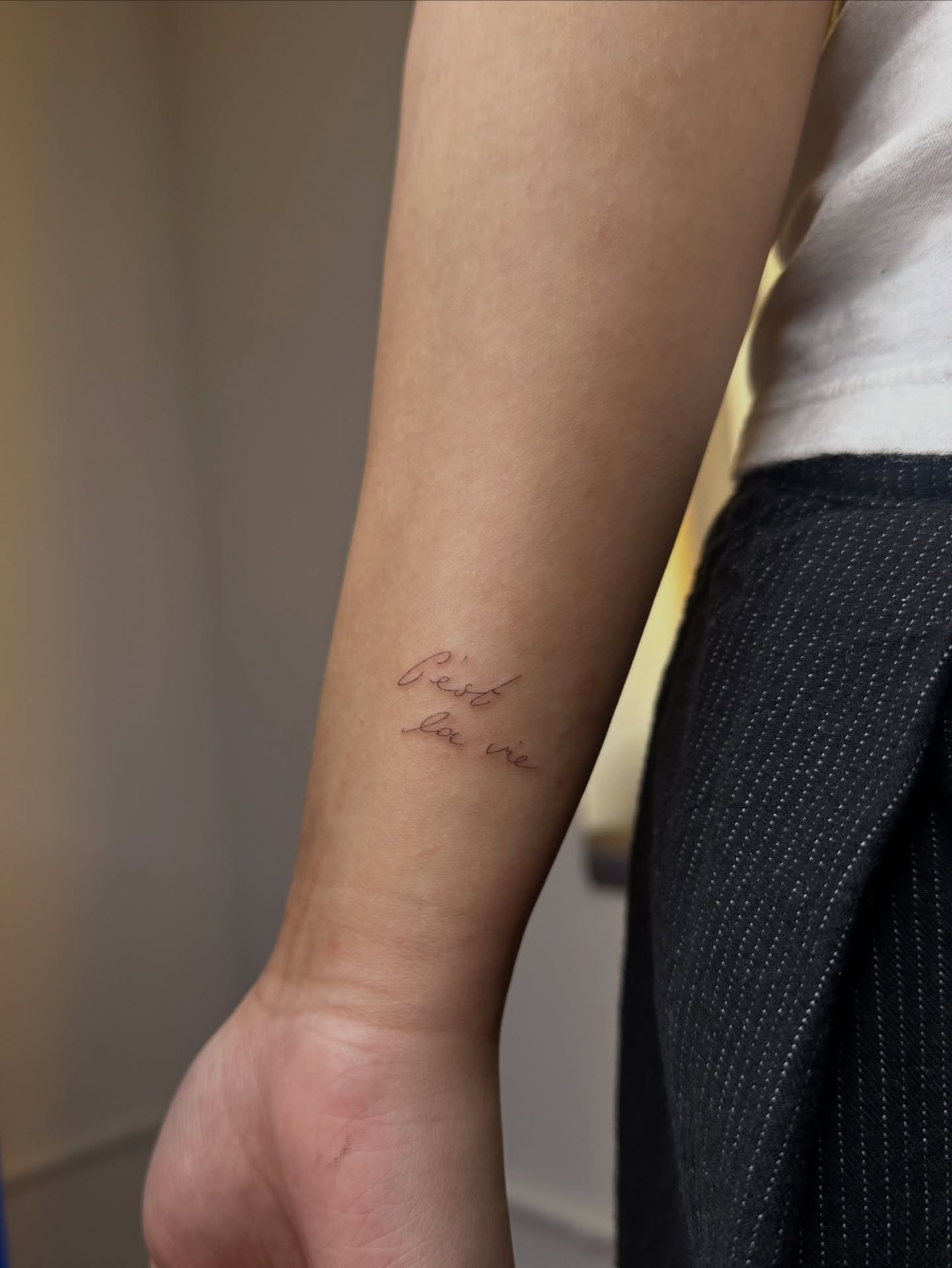 C'est la vie lettering script tattoo on the forearm by @taravychi