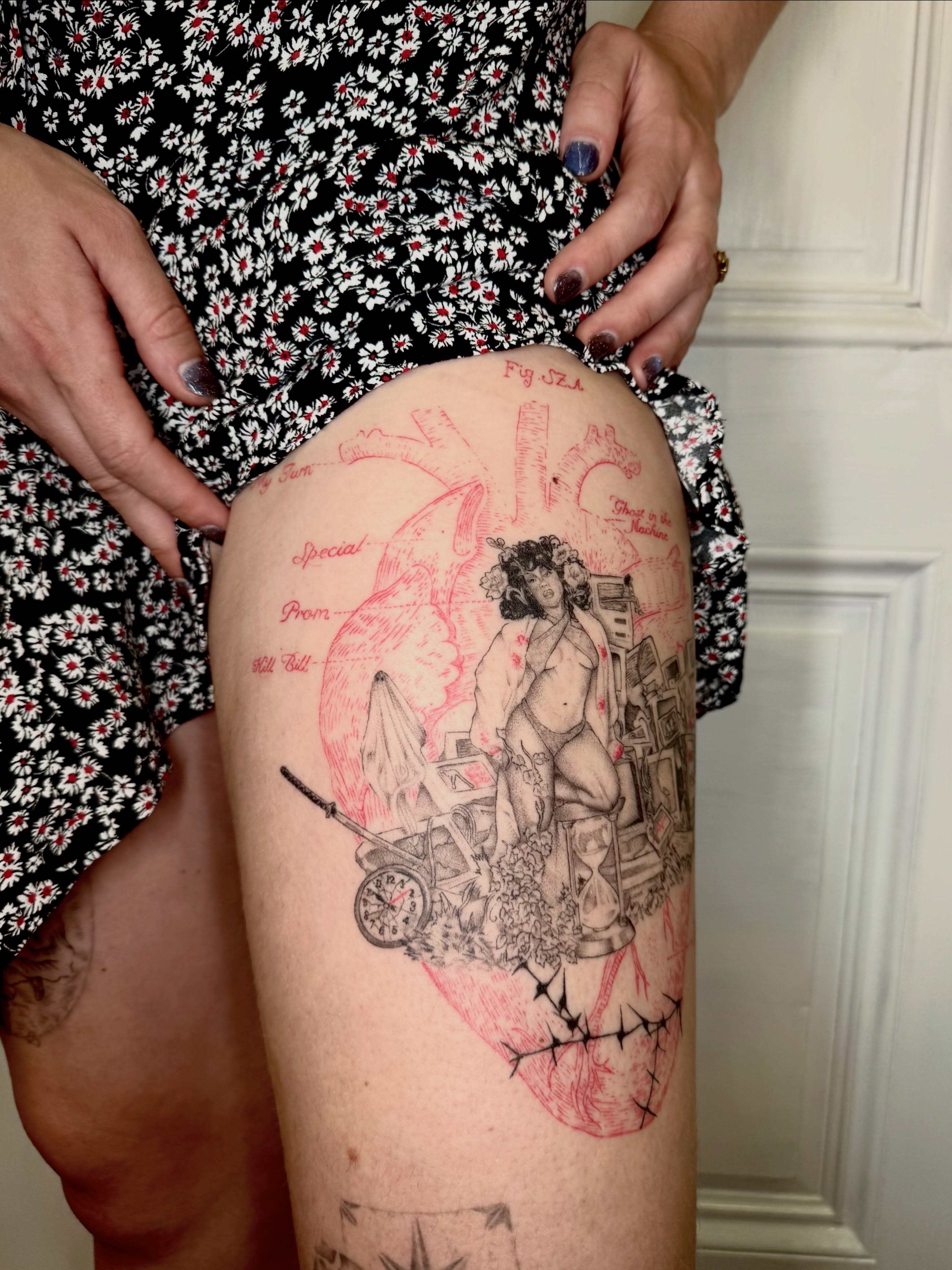 Naked man with hourglass illustrative tattoo on the thigh by Ian Saner