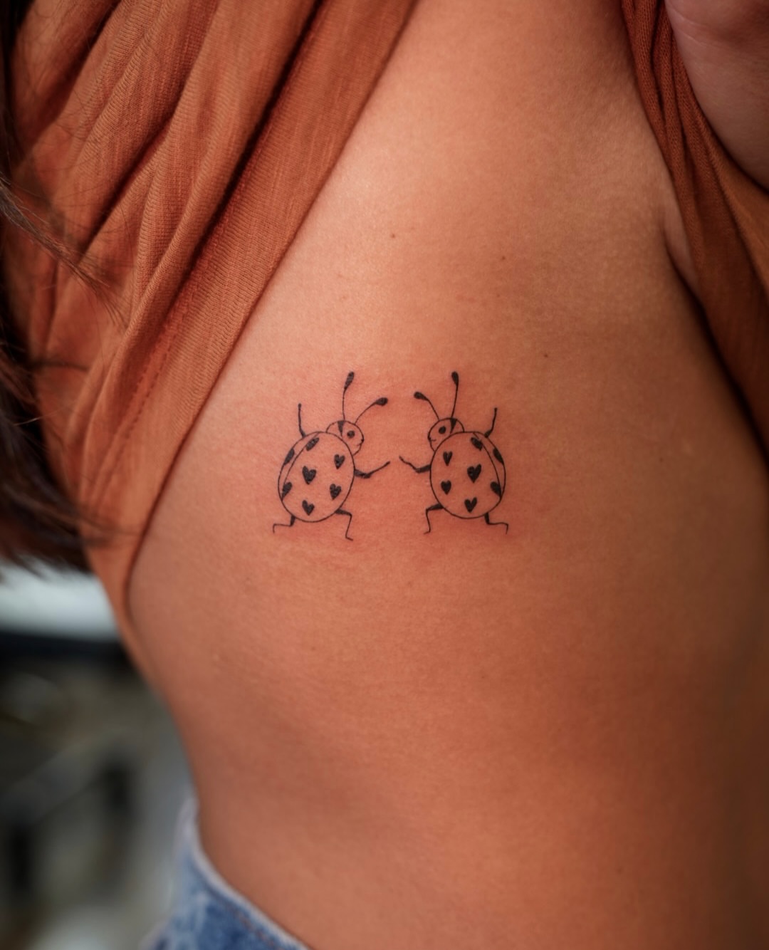 Ladybugs minimalist tattoo on the shoulder by 🤍 Sarah 🖤