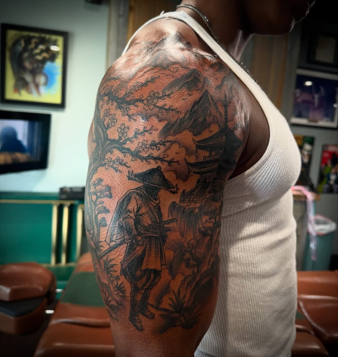 Samurai landscape realism tattoo on the upper arm by Cory Haberman