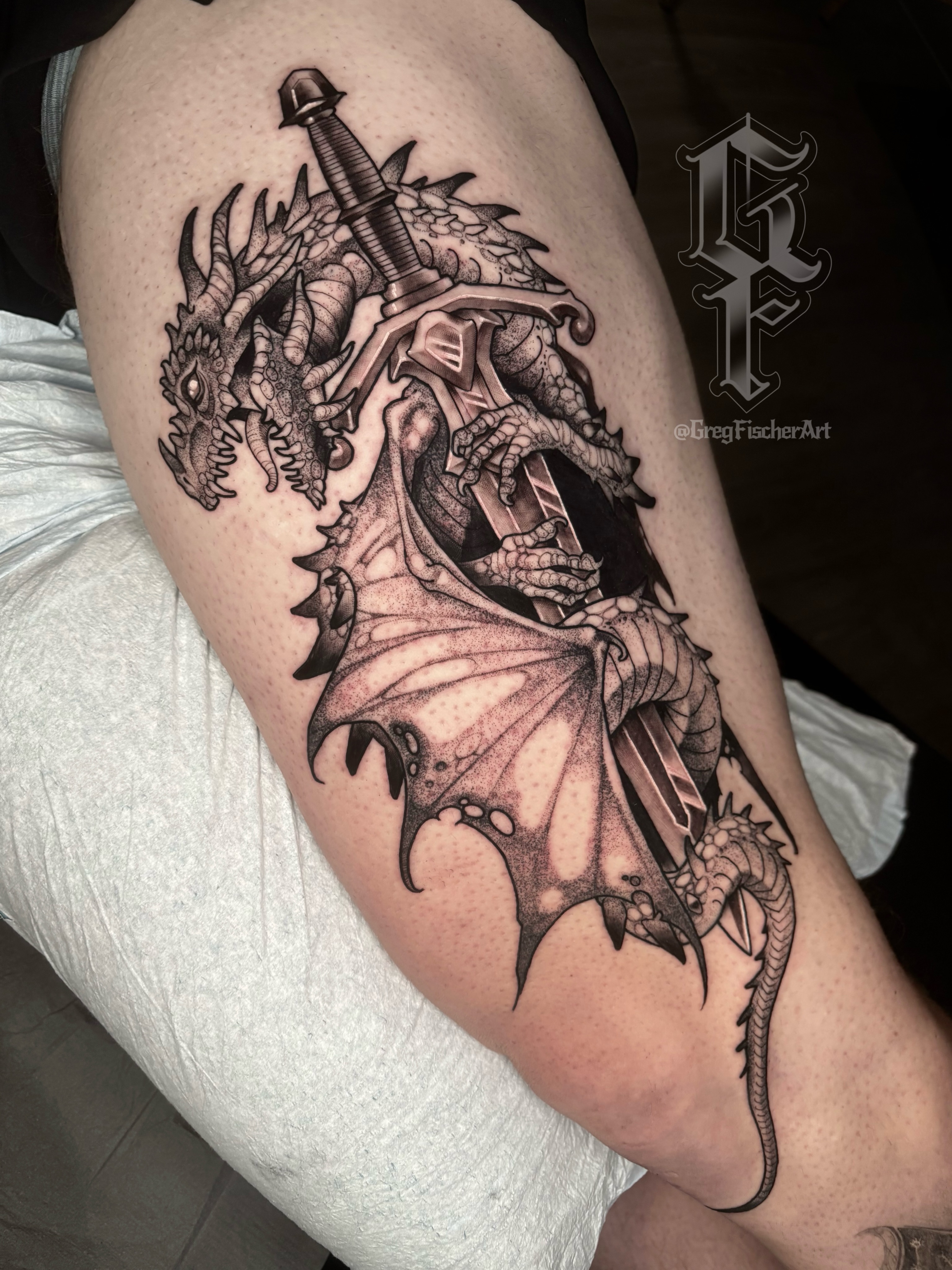 Dragon and sword dotwork tattoo on the thigh by Greg Fischer