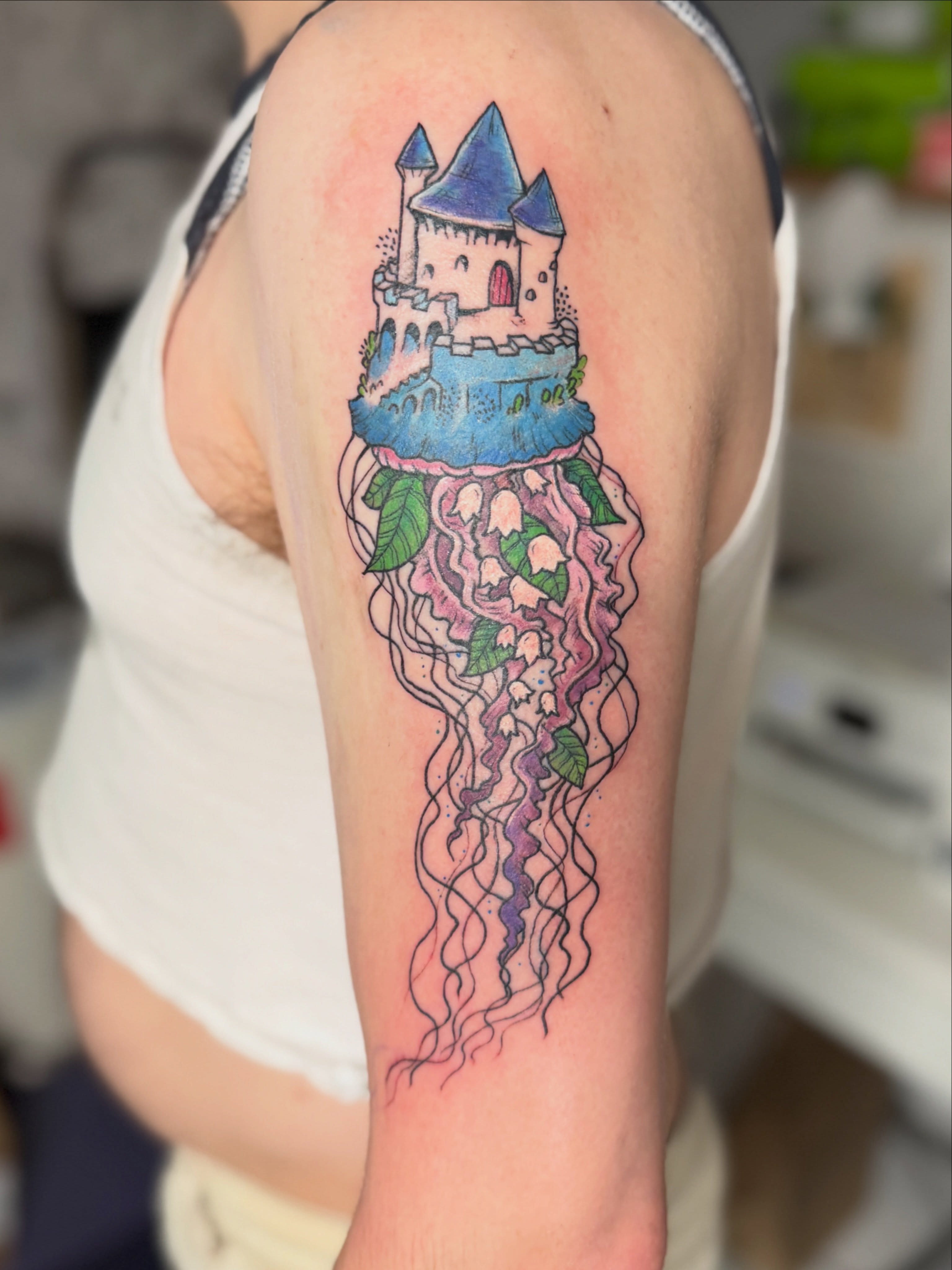 Castle jellyfish new school tattoo on the forearm by Emma Berger