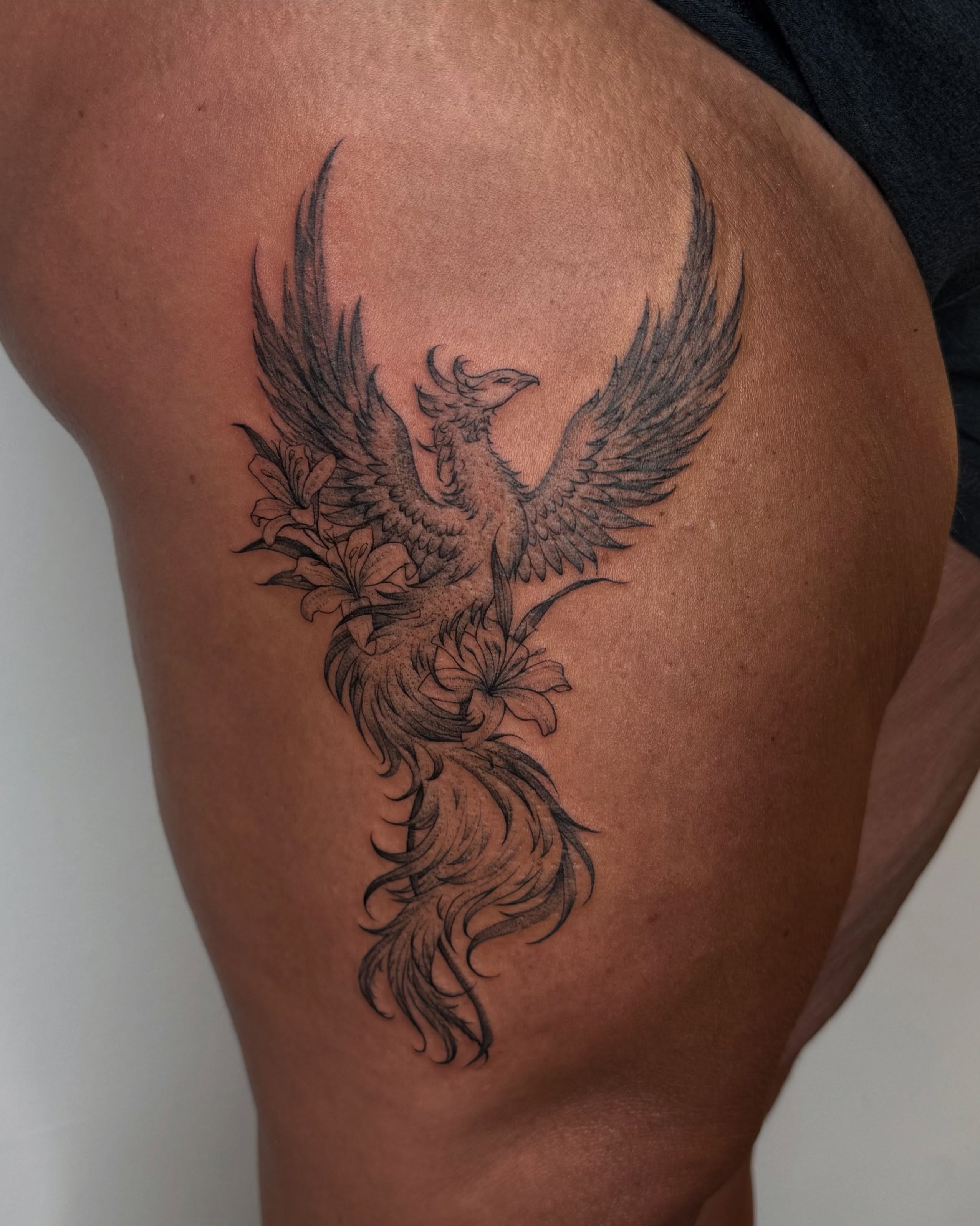 Phoenix black and grey tattoo on the thigh by Carson Mccullers ✨