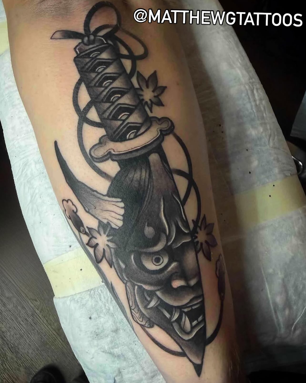 Katana and dragon American traditional tattoo on the forearm by Matthew Gordon