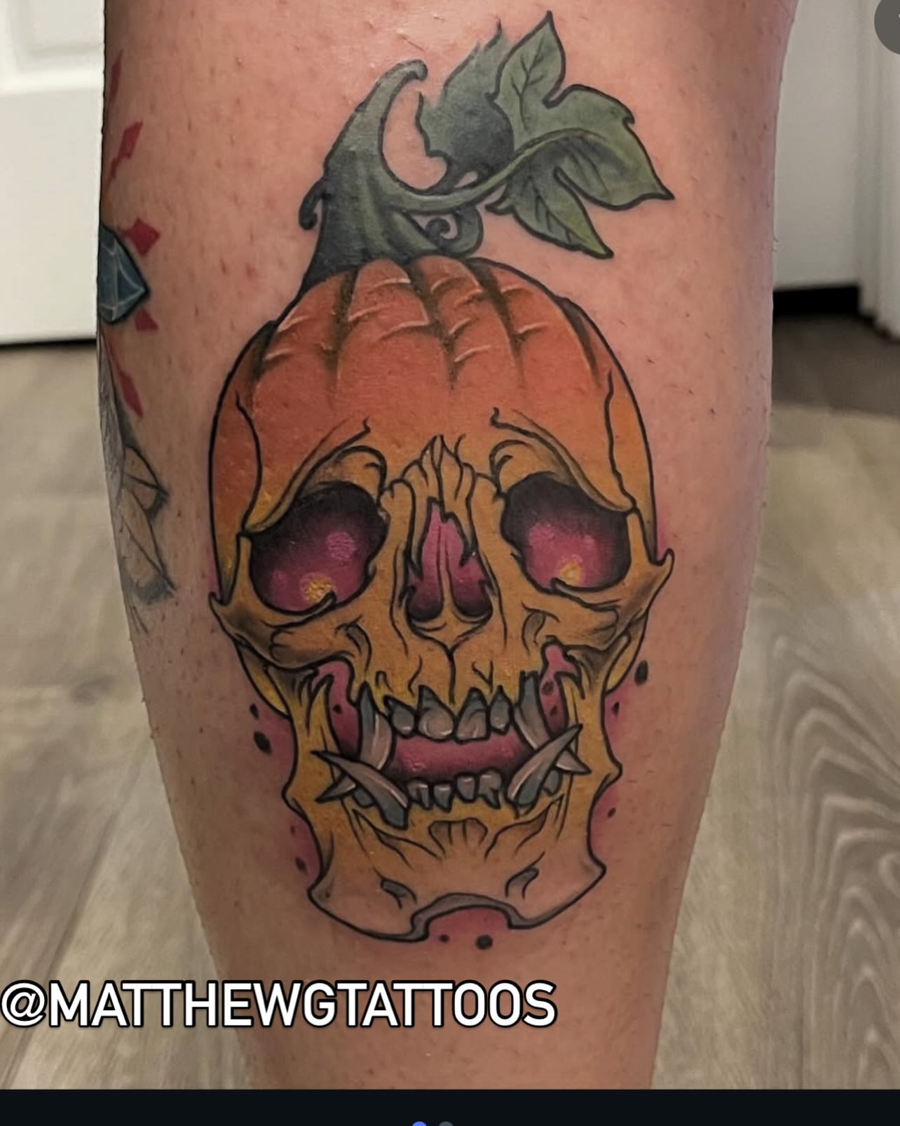 Pumpkin skull American traditional tattoo on the thigh by Matthew Gordon