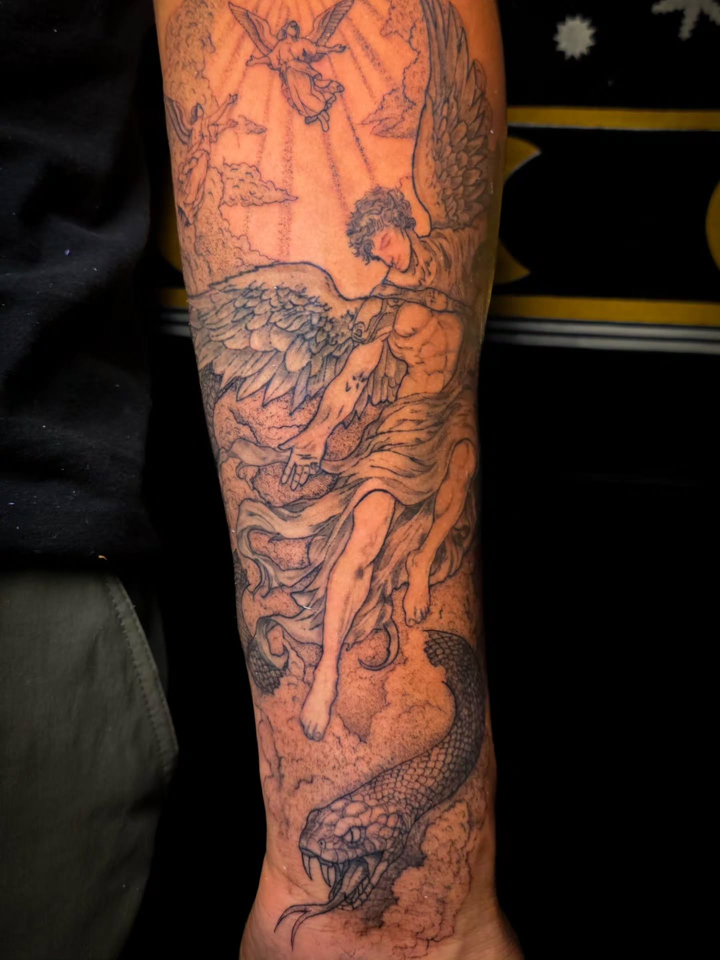 Angel and snake realism tattoo on the forearm by 𝕷𝖚𝖈𝖎𝖉