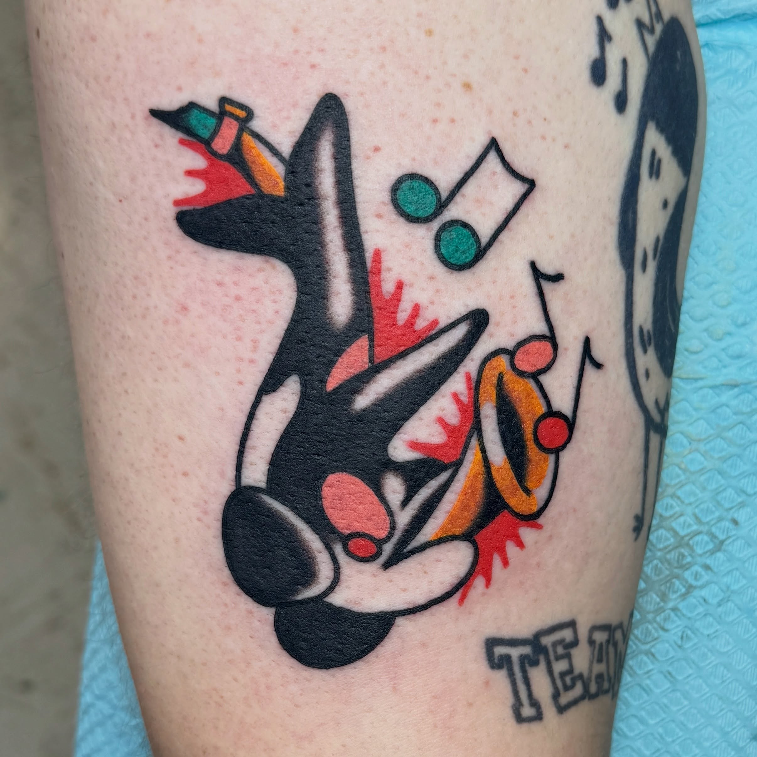 Killer whale geometric tattoo on the forearm by Sam