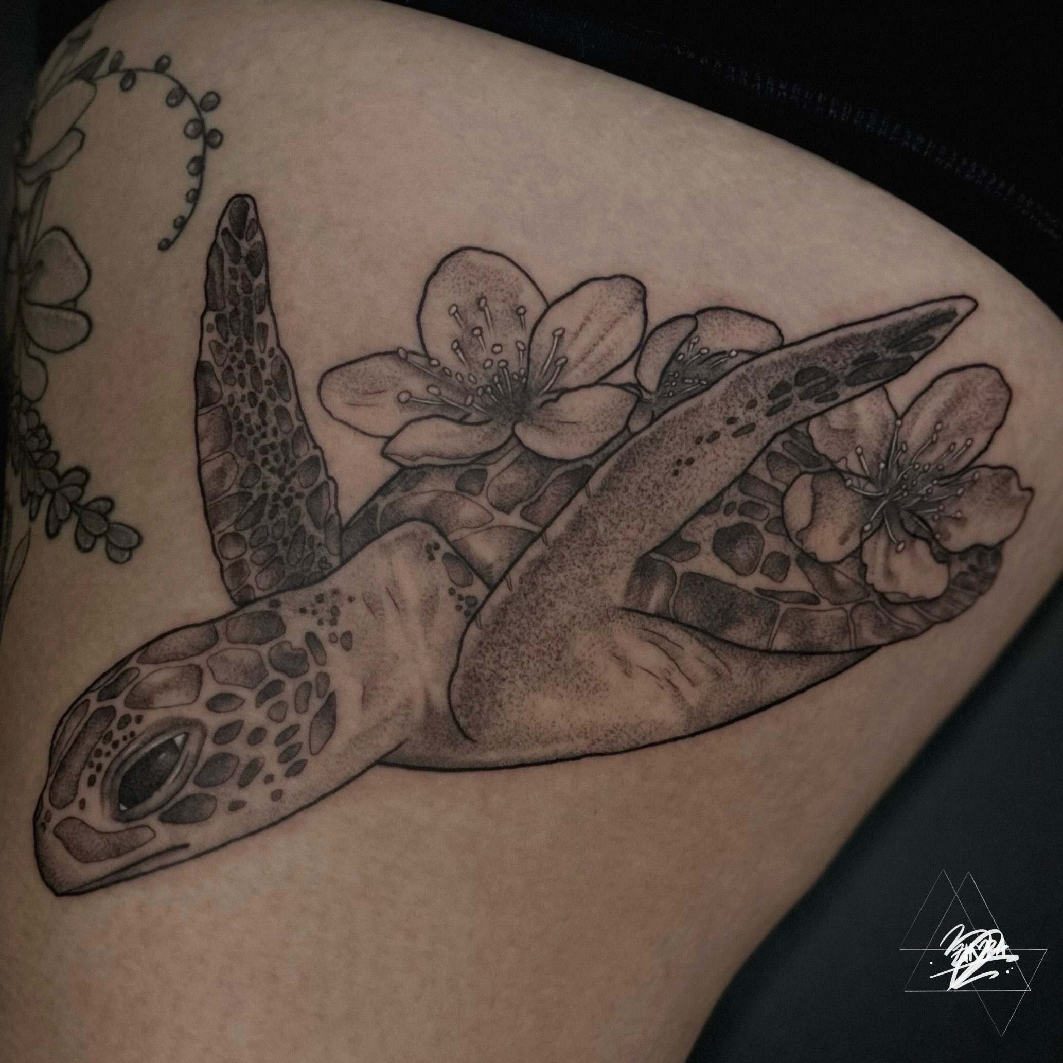 Sea turtle and flowers dotwork tattoo on the thigh by Zhorana Devi