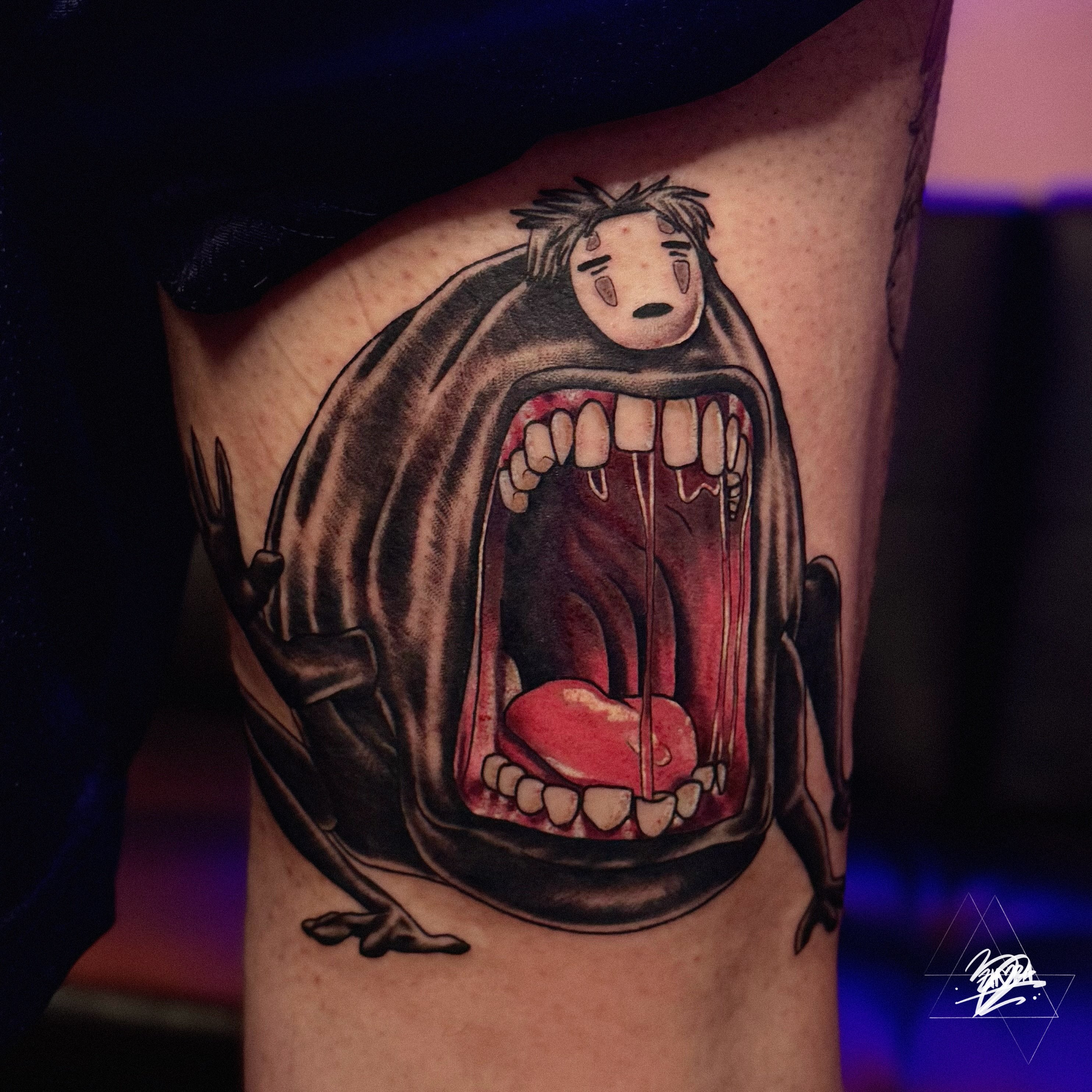 Heart in mouth dark realism tattoo on the thigh by Zhorana Devi