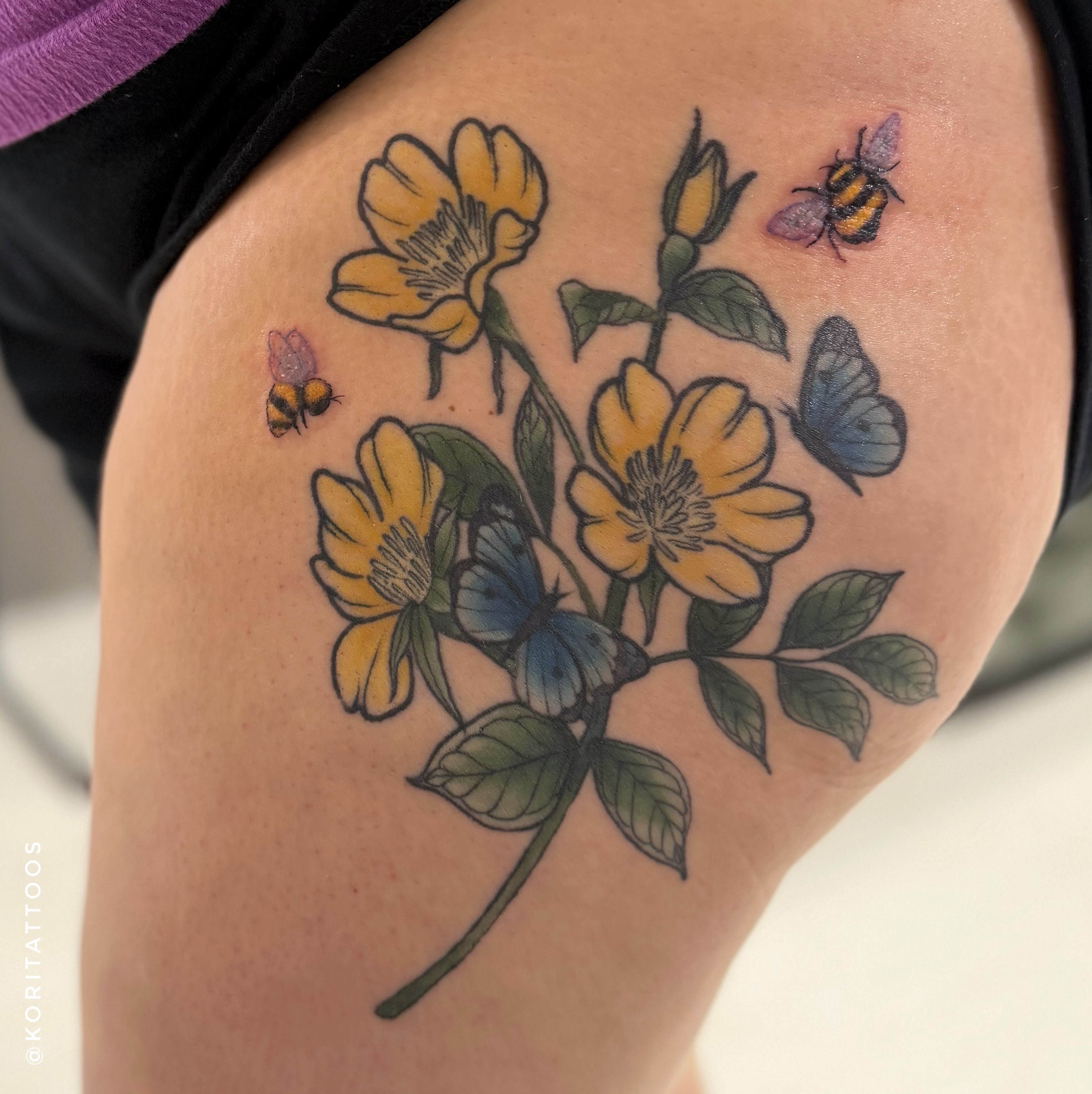 Yellow flowers and butterflies realism tattoo on the thigh by Kori Millhimes