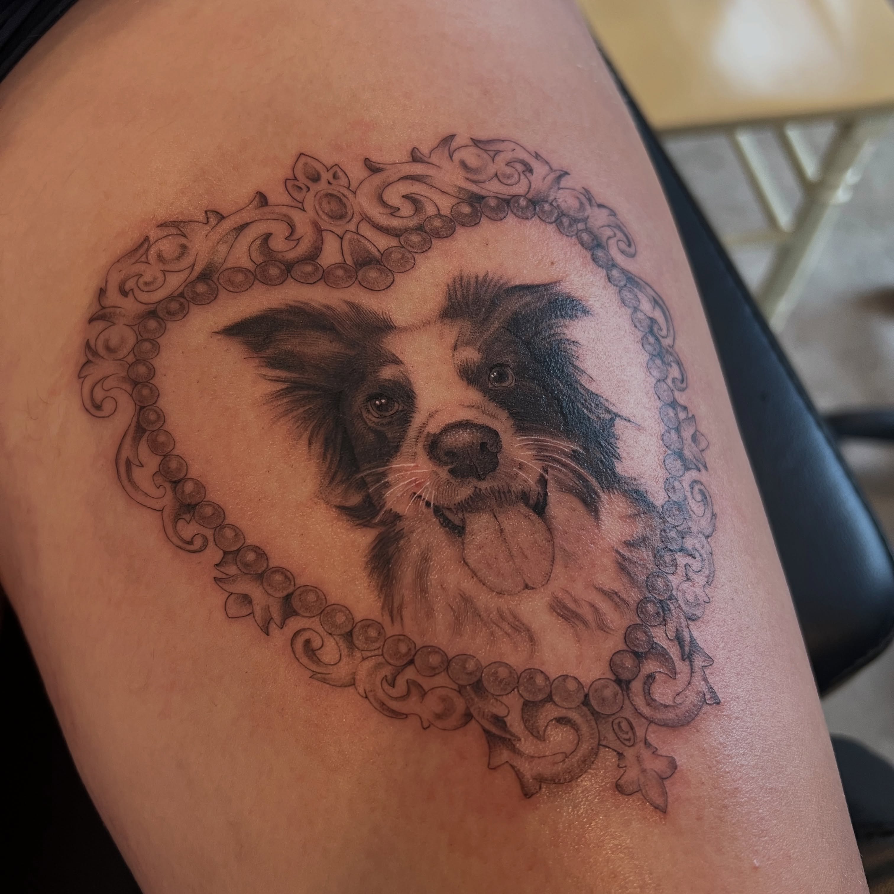 Dog portrait realism tattoo on the thigh by Dom