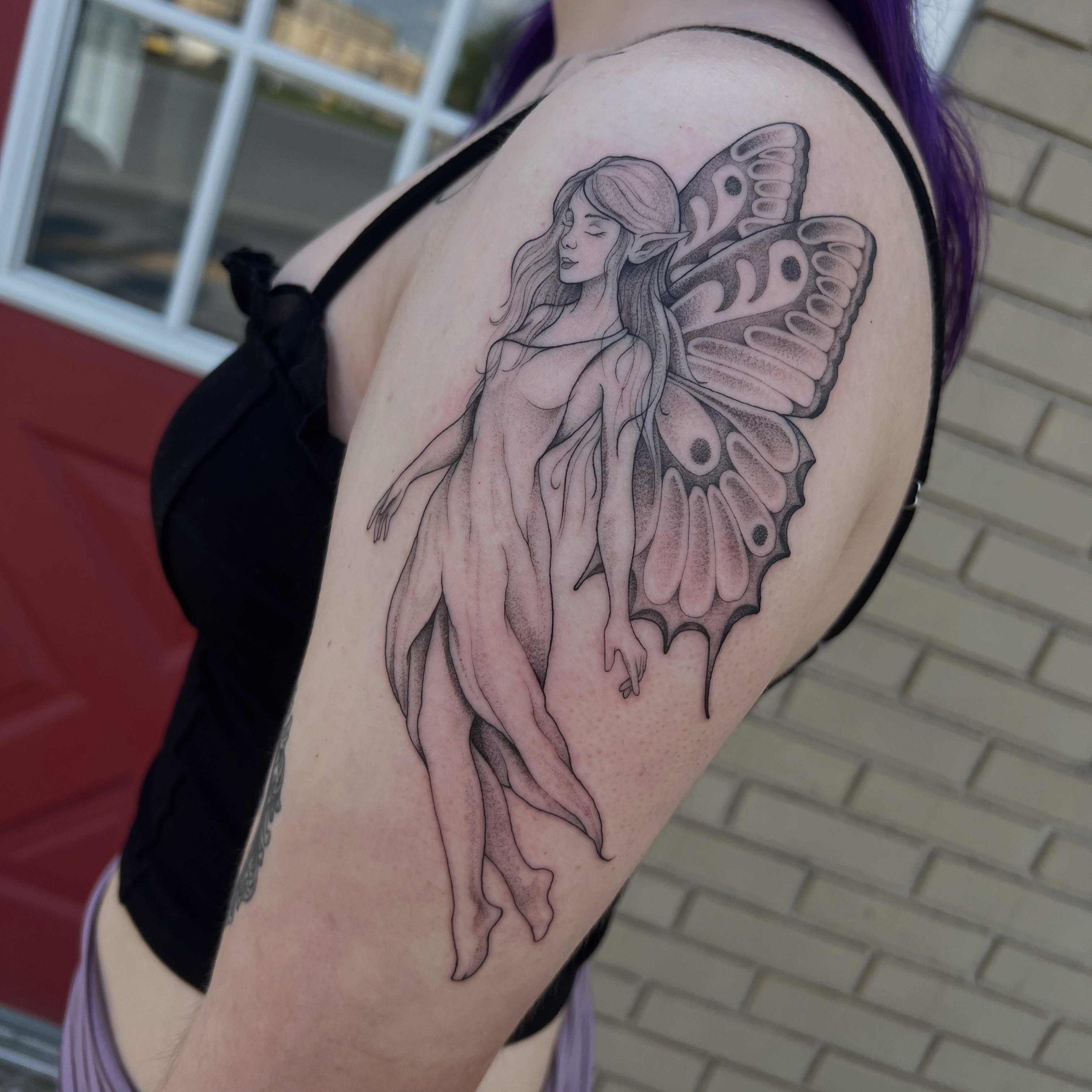 Fairy black and grey tattoo on the shoulder by Dom
