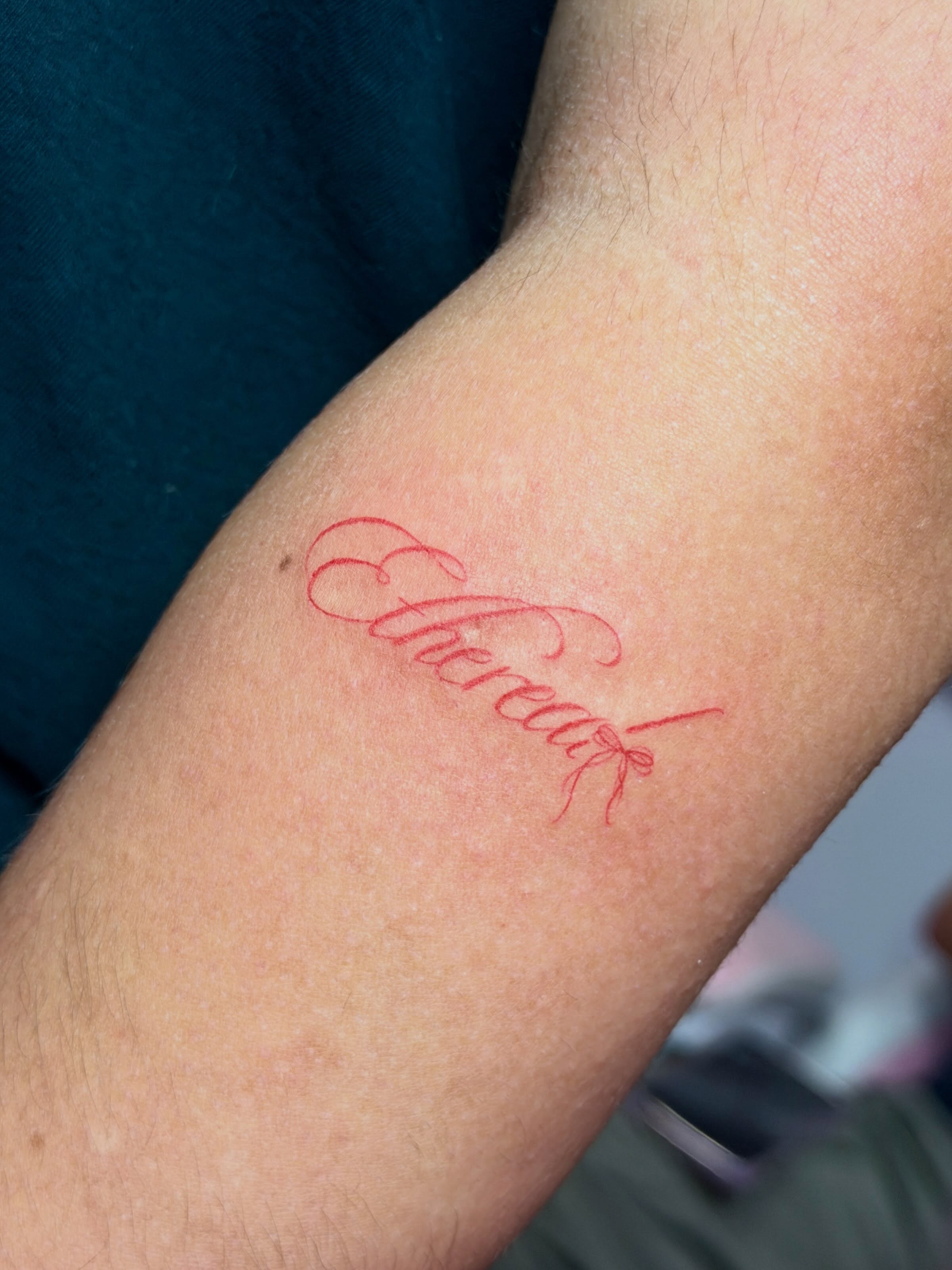 Ethereal lettering script tattoo on the forearm by Baka Ink