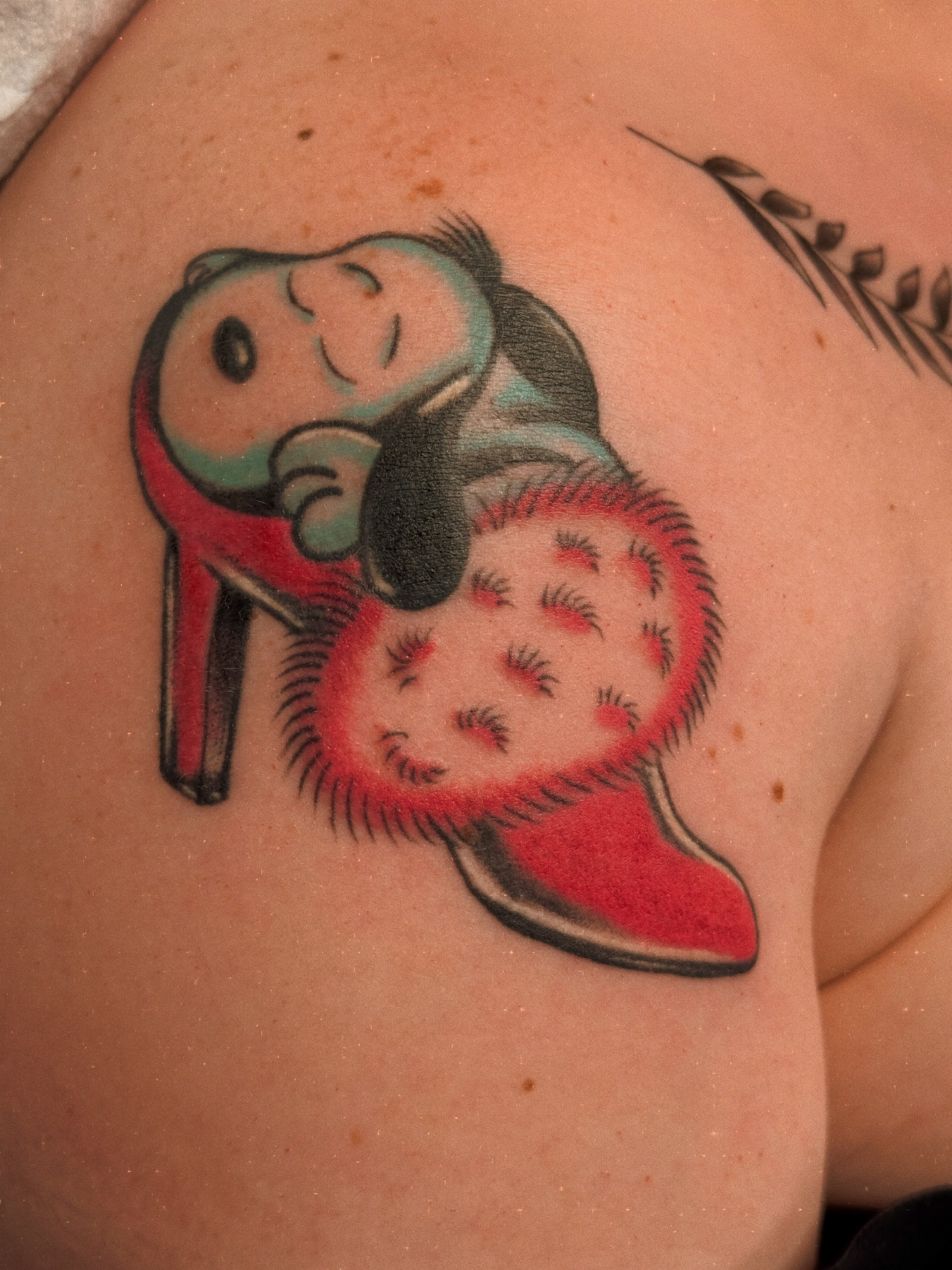 Teddy bear and heart American traditional tattoo on the shoulder by Megan Sue Causemaker