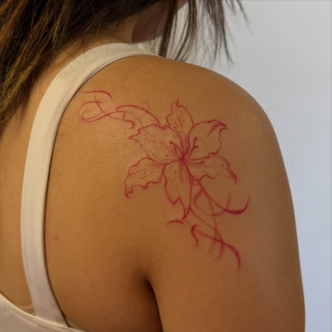 Lily dotwork tattoo on the shoulder by Sienna (jj) Hicks