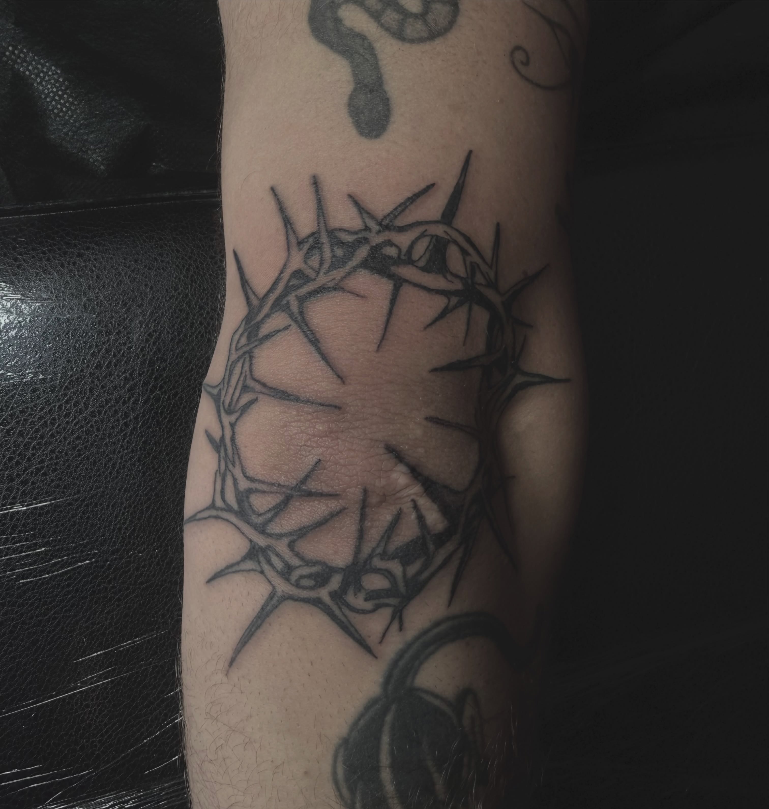 Crown of thorns black and grey tattoo on the forearm by Jordan Sandoval