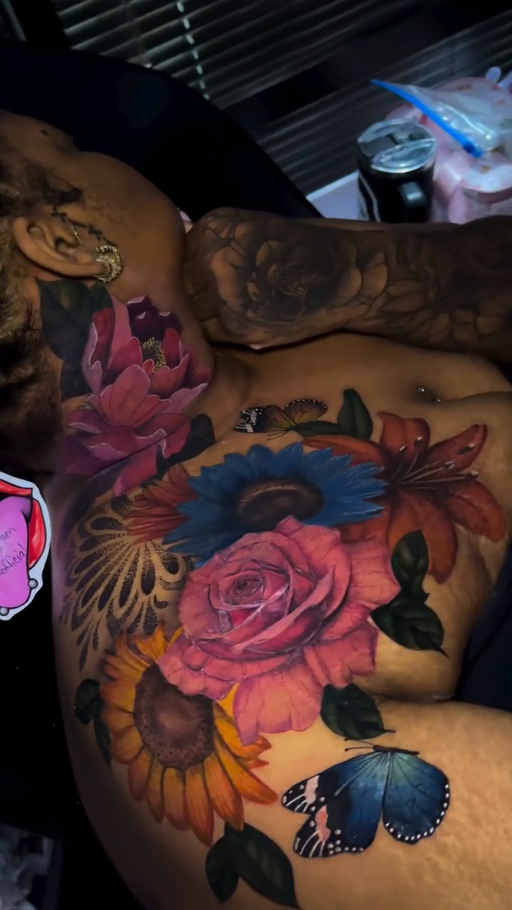 Floral arrangement with butterflies realism tattoo by Doll The Tattoo Artist, Addison, Texas