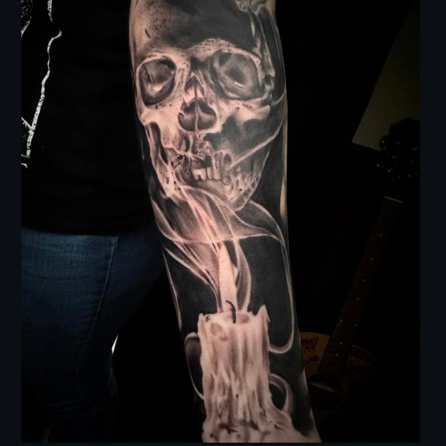 Skull and candle realism tattoo on the forearm by Sideshow Danny