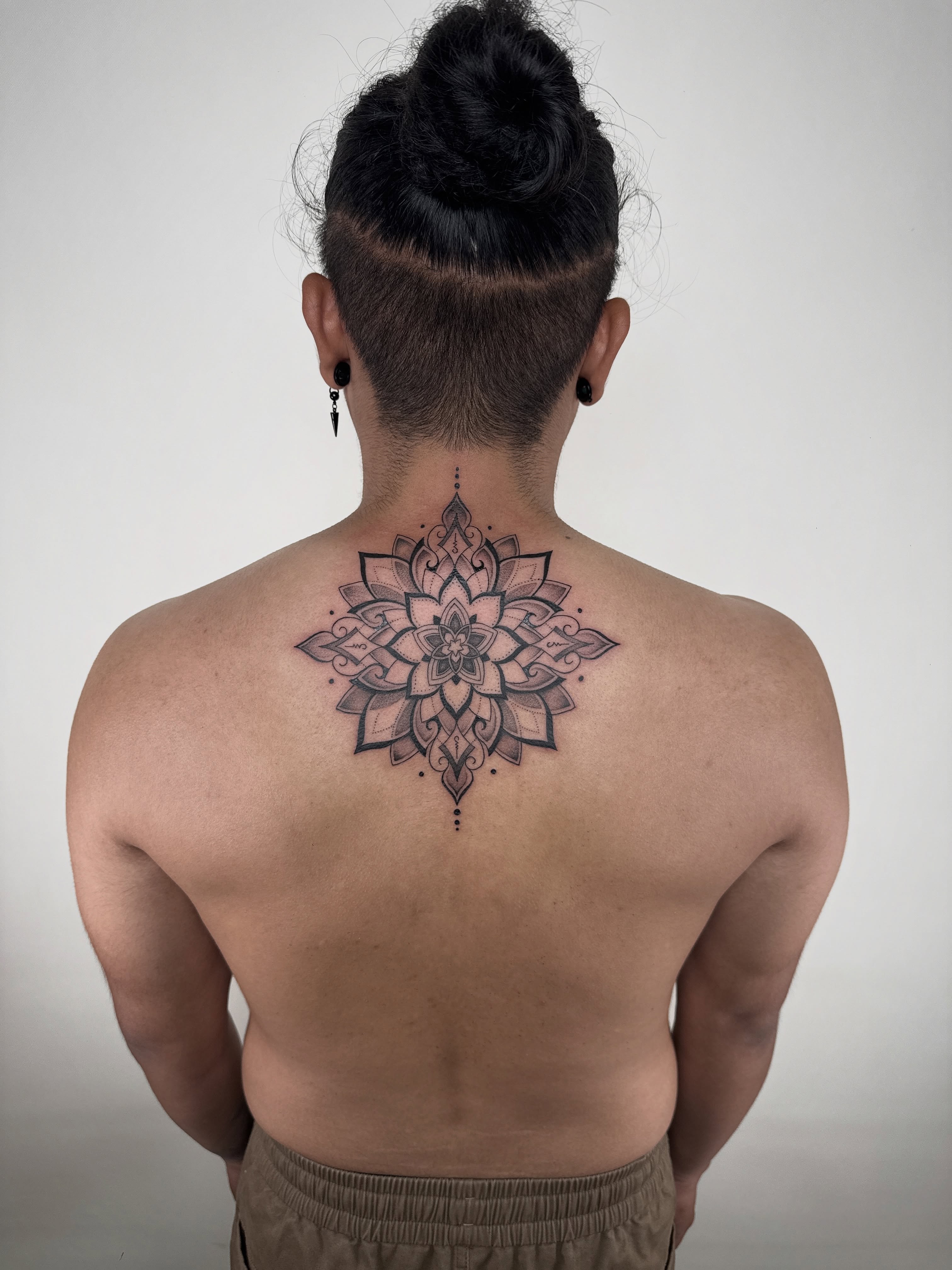 Mandala geometric tattoo on the back by Jadyn Pang